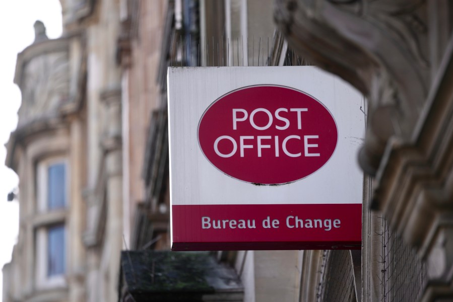 FILE - A logo of a post office is displayed in London, Wednesday, Jan. 10, 2024. (AP Photo/Kin Cheung, File)