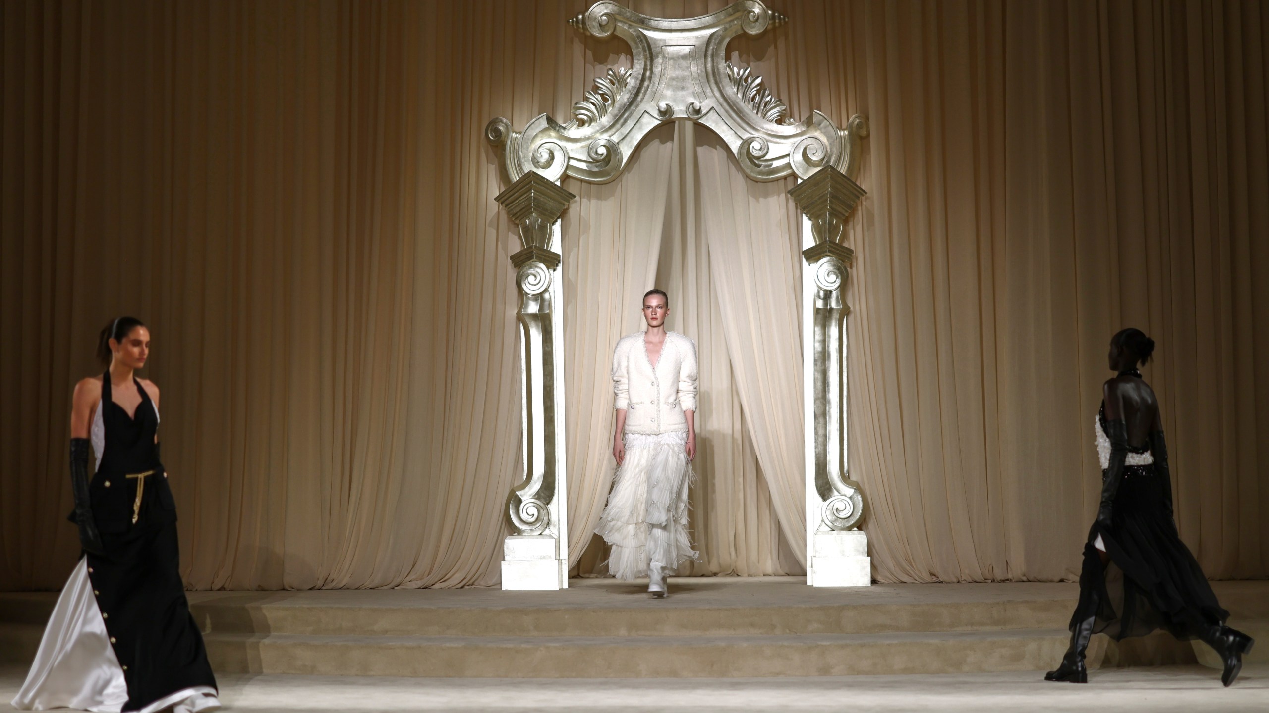 Models wear creations as part of the Chanel Fall-Winter 2025/26 Haute Couture collection presented Tuesday, July 8, 2025, in Paris. (AP Photo/Tom Nicholson)