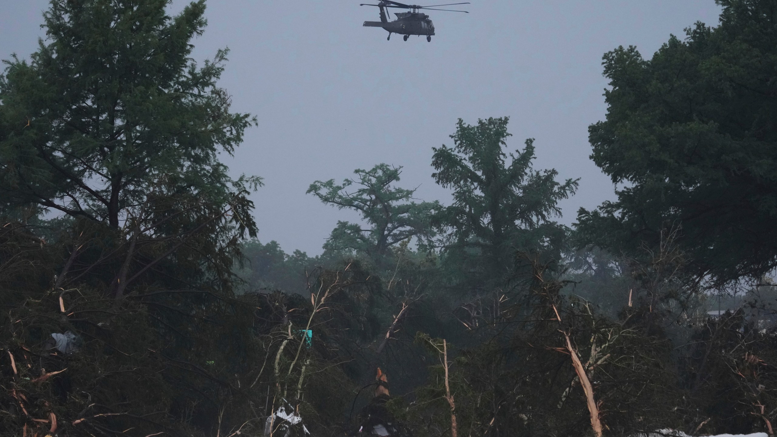 FILE - A helicopter flies over the Guadalupe River after a flash flood swept through the area July 4, 2025, in Kerrville, Texas. (AP Photo/Eric Gay, File)