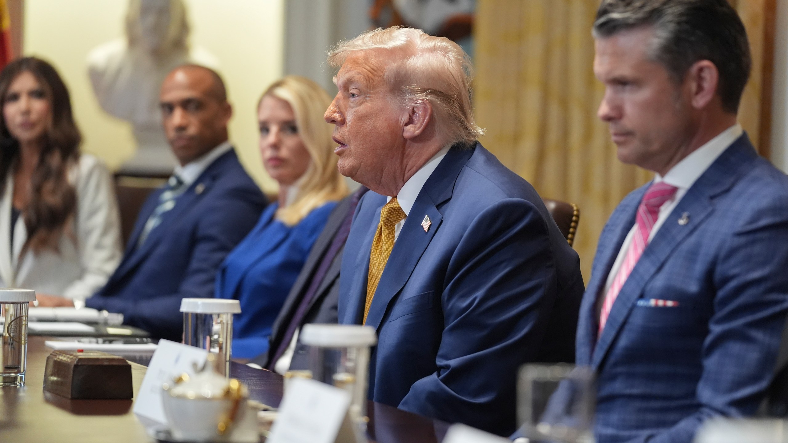President Donald Trump, center, speaking during a cabinet meeting with from l-r., Homeland Security Secretary Kristi Noem, Secretary of Housing, Eric Scott Turner, Attorney General Pam Bondi, Secretary of State Marco Rubio and Secretary of Defense Pete Hegseth, at the White House, Tuesday, July 8, 2025, in Washington. (AP Photo/Evan Vucci)