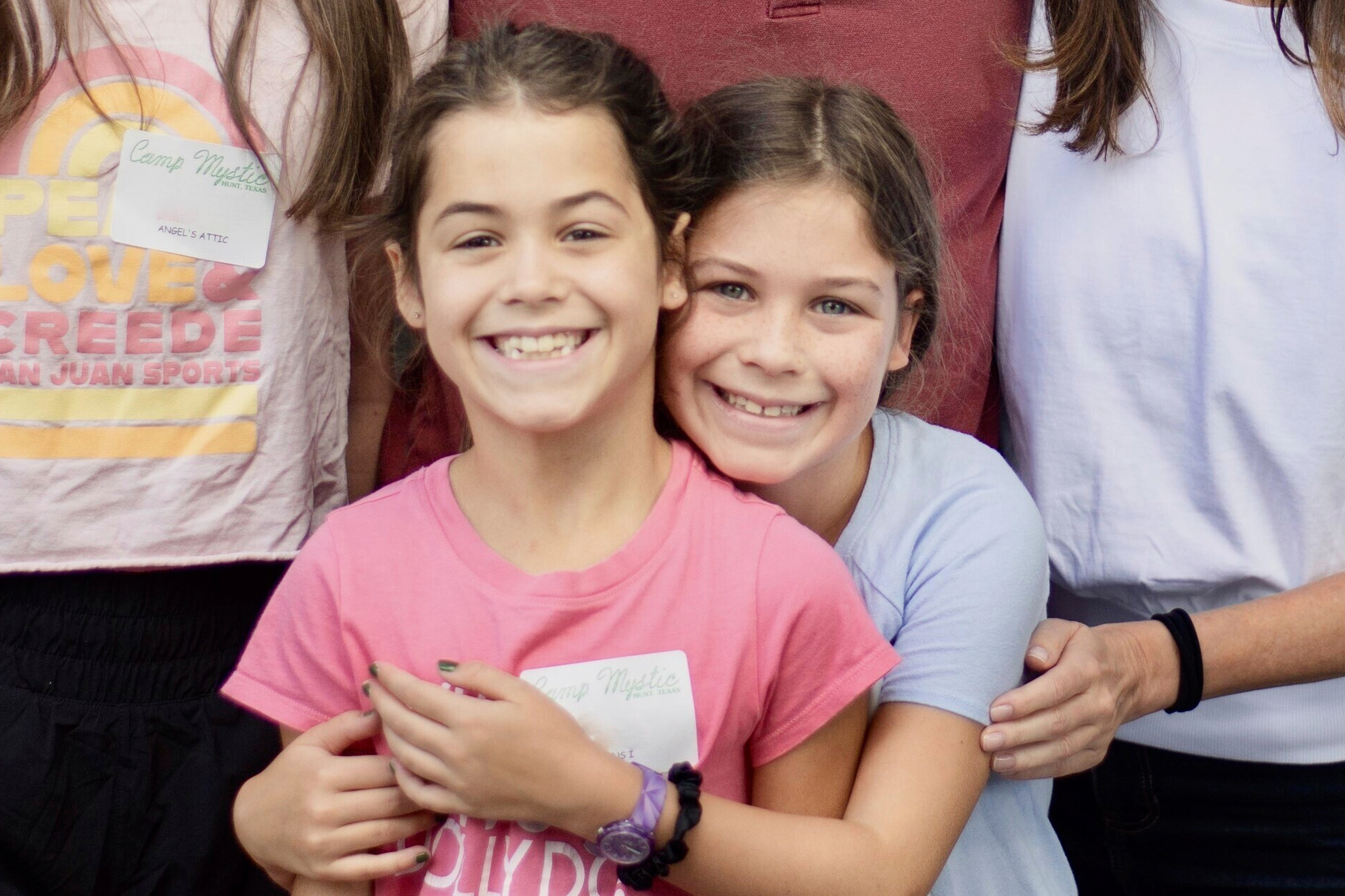 This undated photo provided by John Lawrence on Monday, July 7, 2025, shows twin sisters, Hanna Lawrence, left, and Rebecca Lawrence, right, who were two the victims killed by the flooding at Camp Mystic in central Texas on Friday, July 4. (John Lawrence via AP)