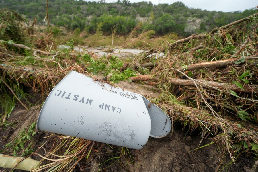 A Camp Mystic mailbox lies near the entrance to the camp along the banks of the Guadalupe River, Saturday, July 5, 2025, in Hunt, Texas, after a flash flood swept through the area. (AP Photo/Julio Cortez)