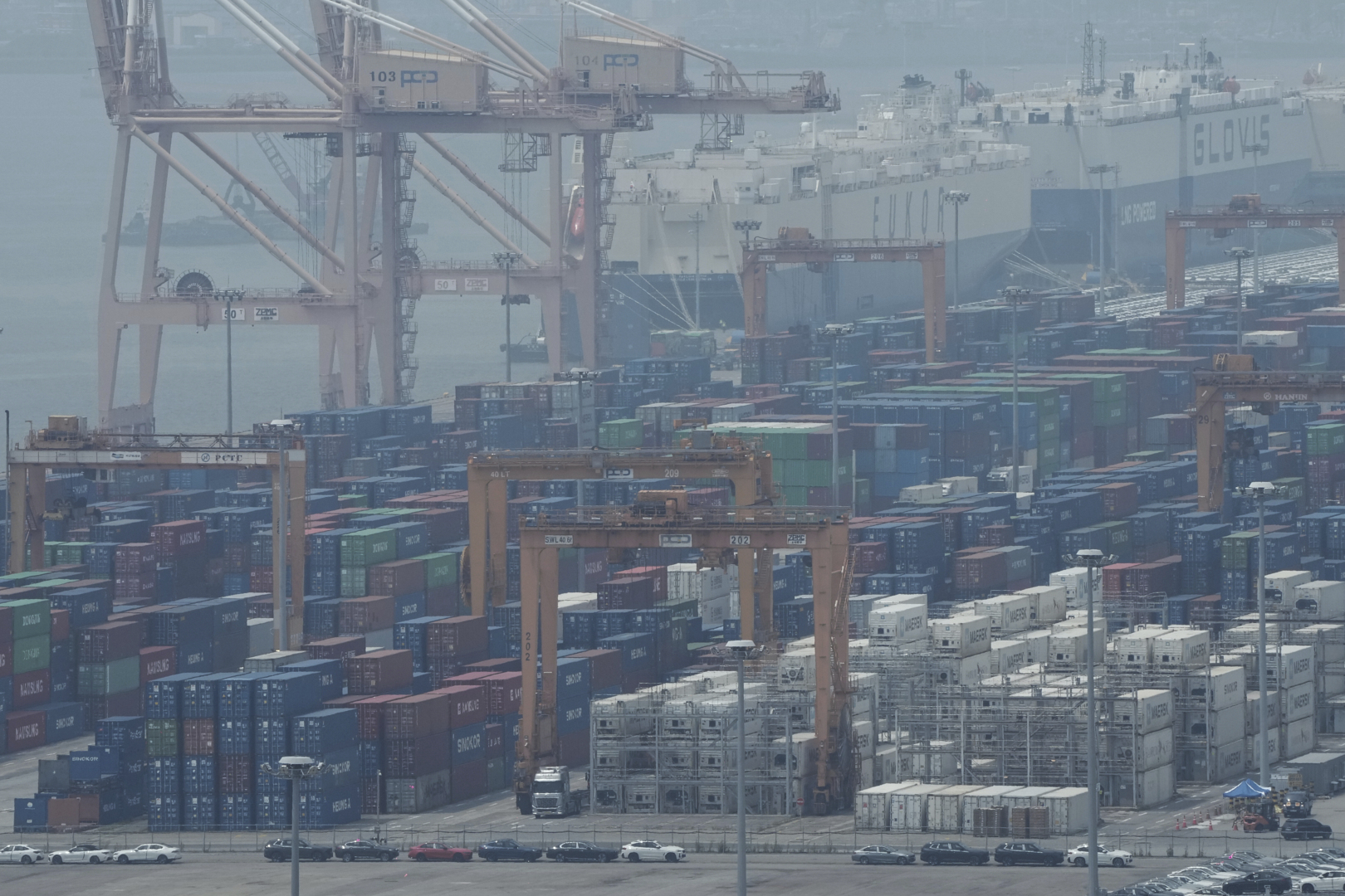 Cranes and shipping containers are seen at a port in Pyeongtaek, South Korea, Tuesday, July 8, 2025. (AP Photo/Ahn Young-joon)