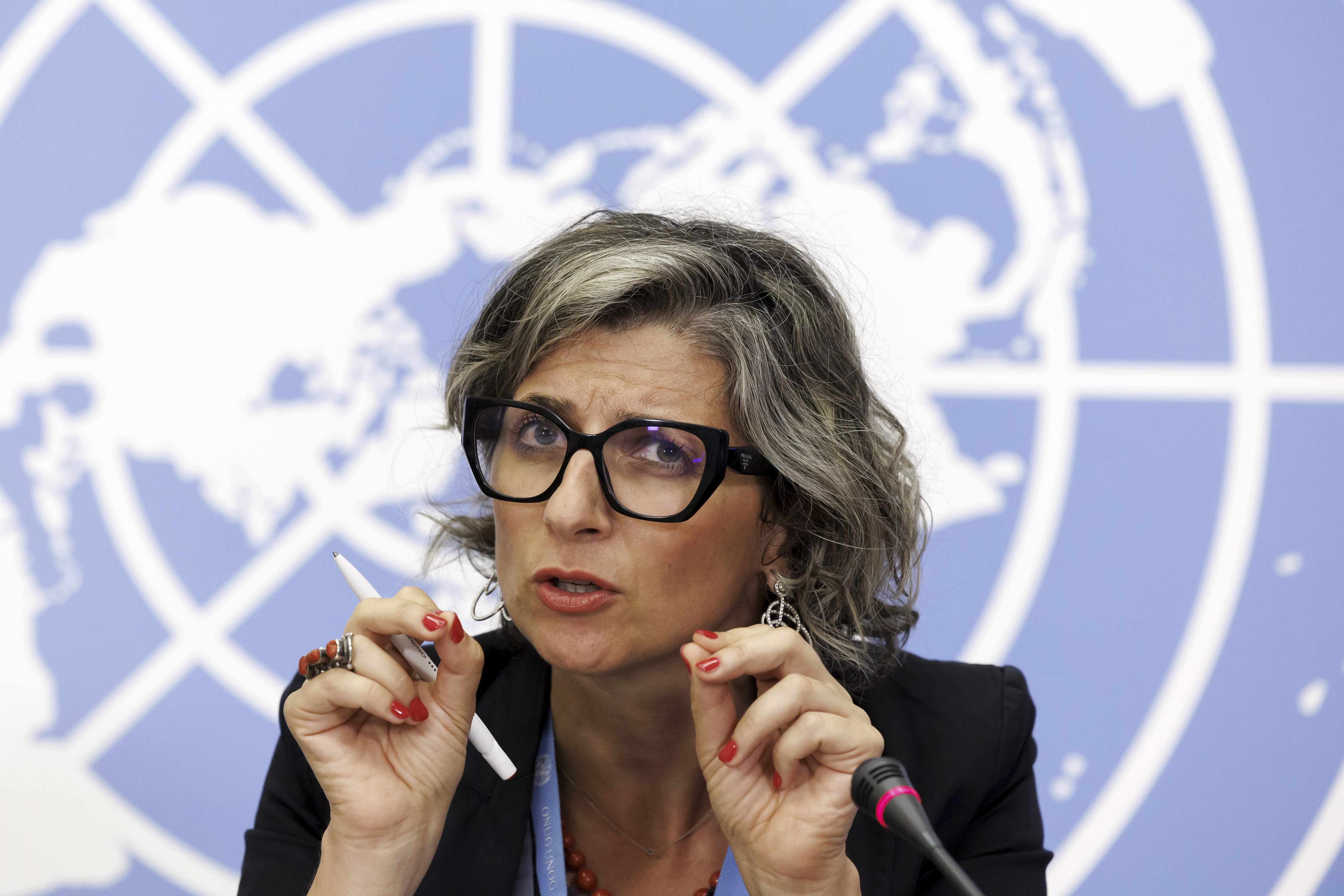 FILE - Francesca Albanese, Special Rapporteur on the situation of human rights in the Palestinian territories occupied since 1967, talks to the media during a press conference at the European headquarters of the United Nations in Geneva, Switzerland, July 11, 2023. (Salvatore Di Nolfi/Keystone via AP, File)