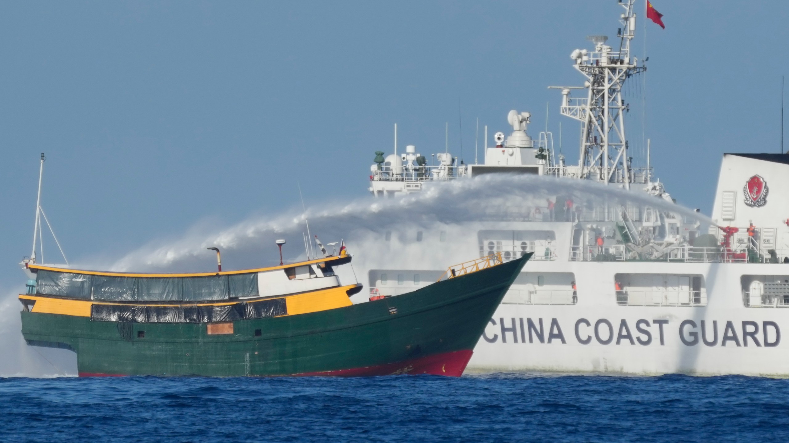 FILE - Philippine resupply vessel Unaizah May 4 is hit by Chinese coast guard water canon blast causing injuries to multiple crew members as they tried to enter the Second Thomas Shoal, locally known as Ayungin Shoal, in the disputed South China Sea Tuesday, March 5, 2024. (AP Photo/Aaron Favila, File)