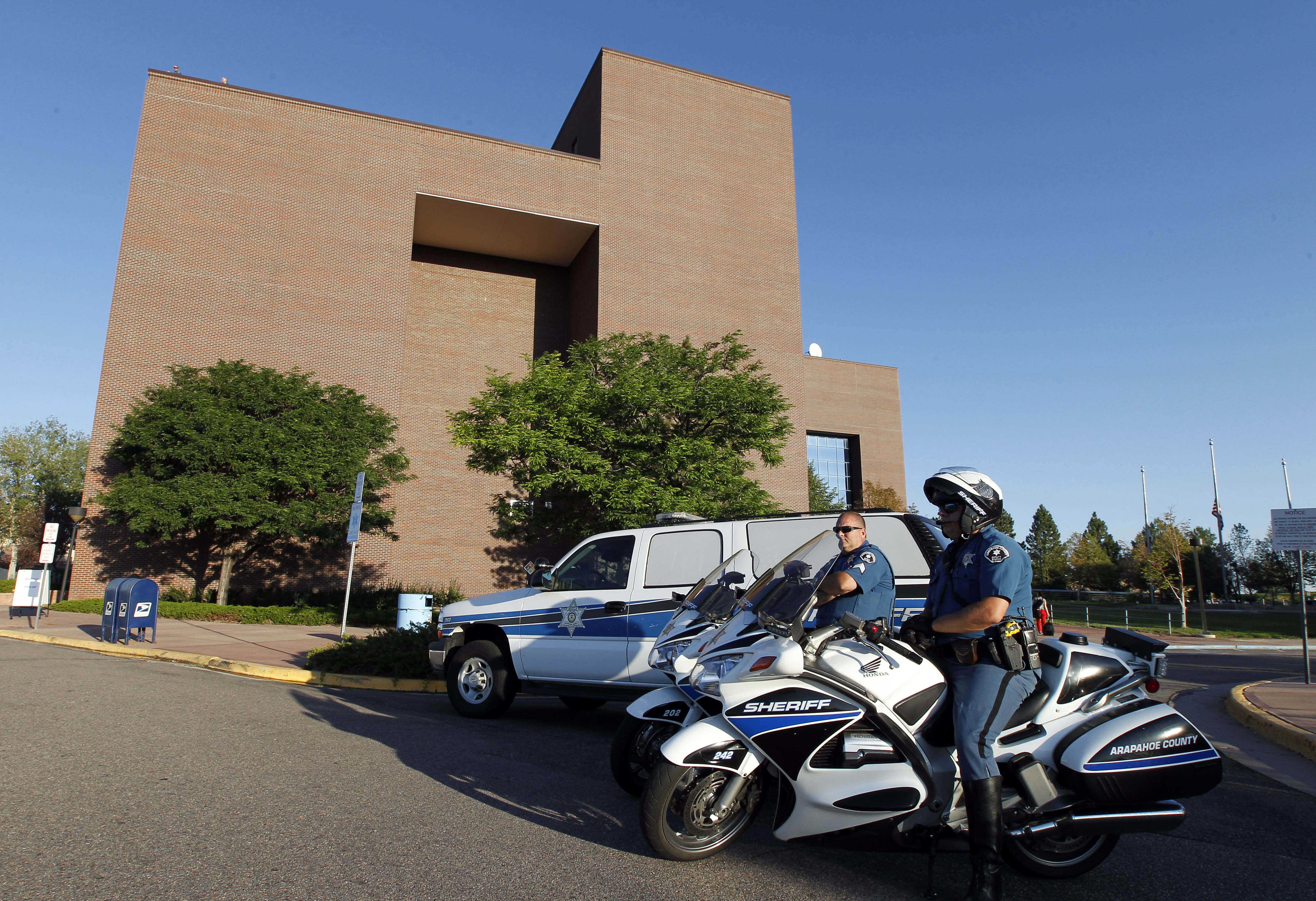 FILE - Law enforcement personnel provide security for a court appearance at the Arapahoe County Courthouse, July 23, 2012, in Centennial, Colo. (AP Photo/Alex Brandon, File)