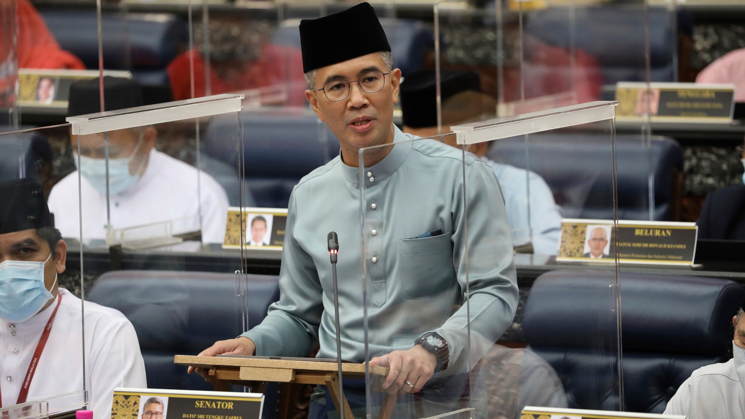 FILE - Malaysia's Finance Minister Zafrul Aziz delivers the 2021 budget speech at parliament in Kuala Lumpur, Malaysia, Nov. 6, 2020. (AP Photo/Vincent Thian, File)
