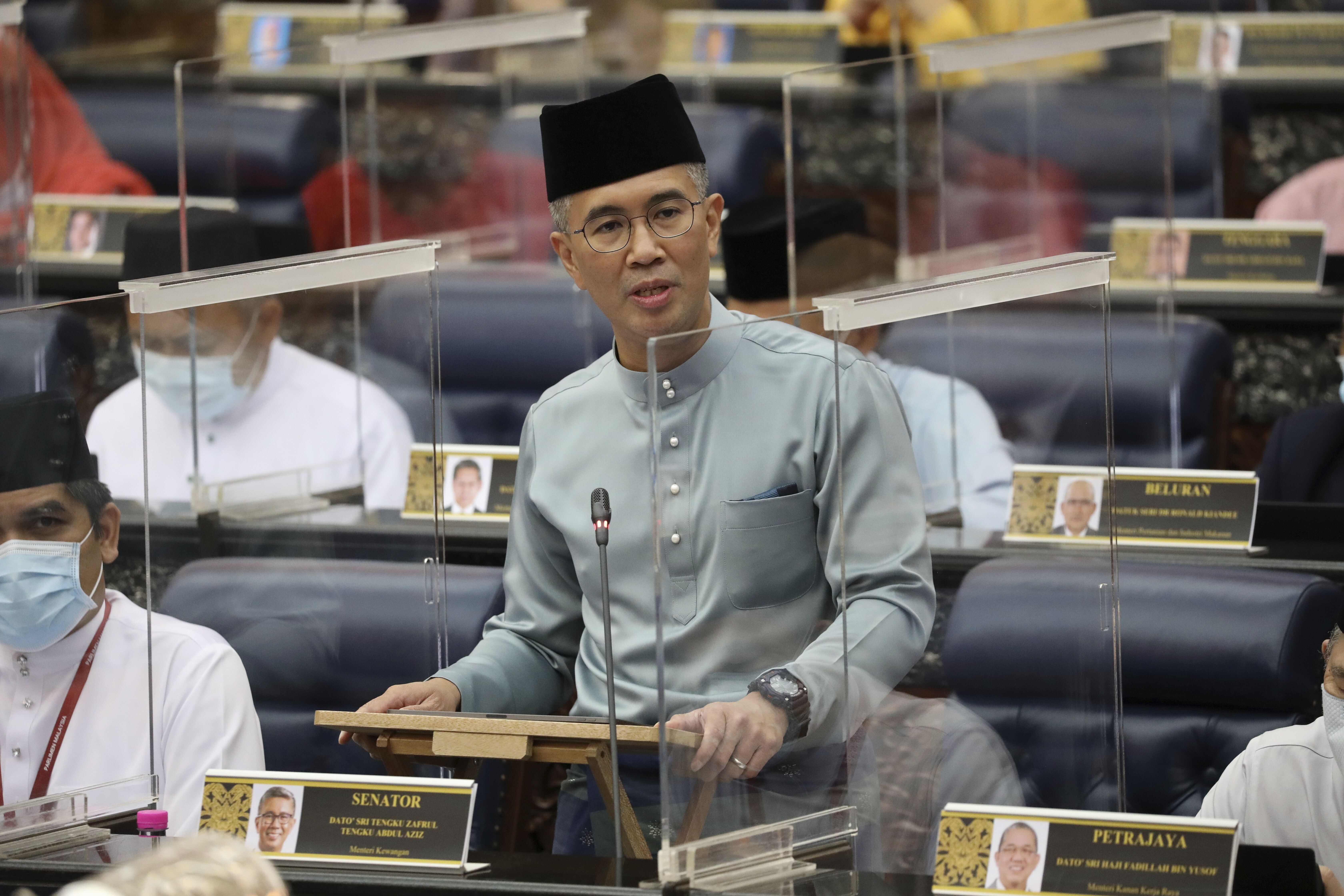 FILE - Malaysia's Finance Minister Zafrul Aziz delivers the 2021 budget speech at parliament in Kuala Lumpur, Malaysia, Nov. 6, 2020. (AP Photo/Vincent Thian, File)