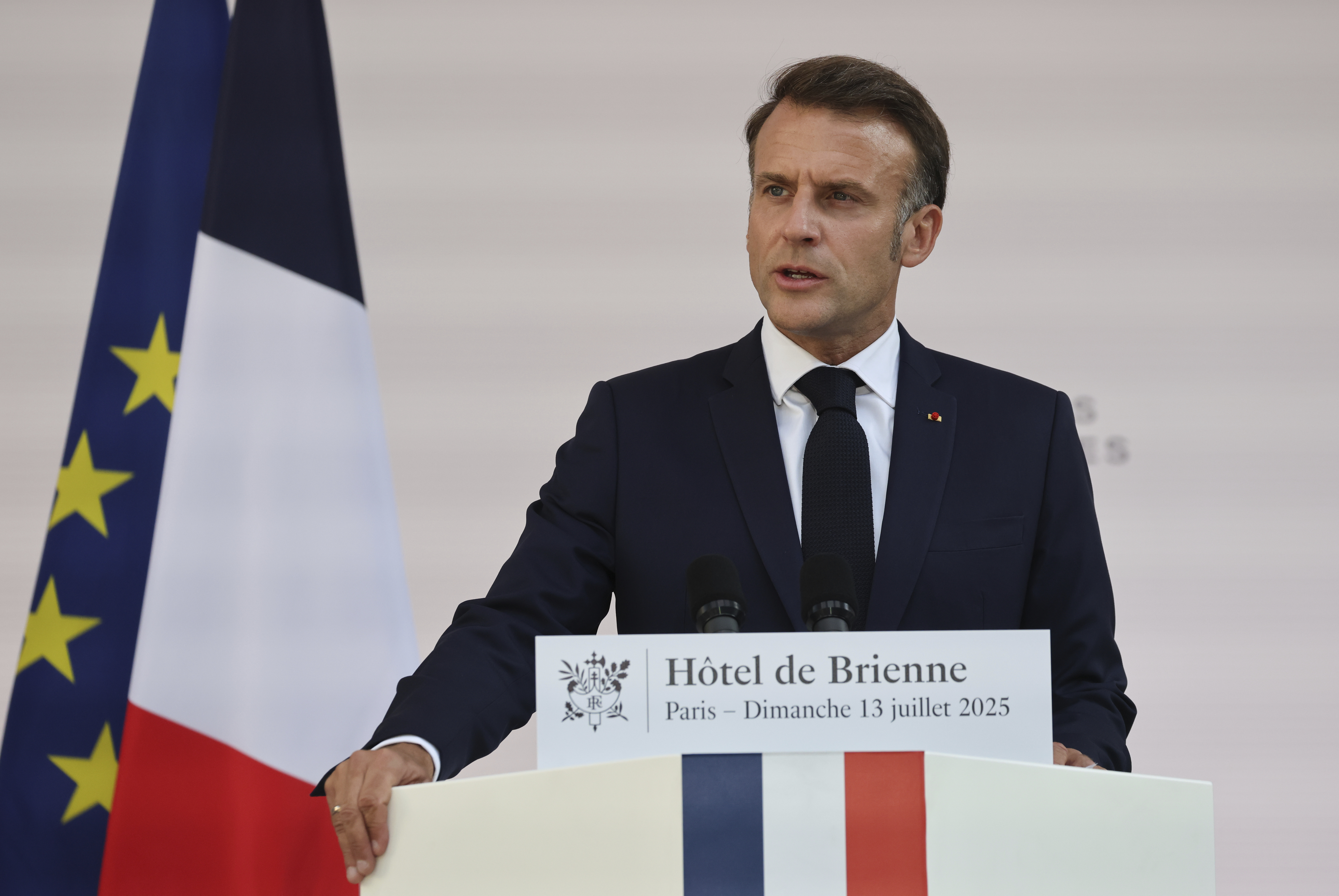 French President Emmanuel Macron speaks to the army leaders at the Hotel le Brienne, Sunday, July 13, 2025, ahead of the Bastille Day parade in Paris. (Ludovic Marin, Pool Photo via AP)