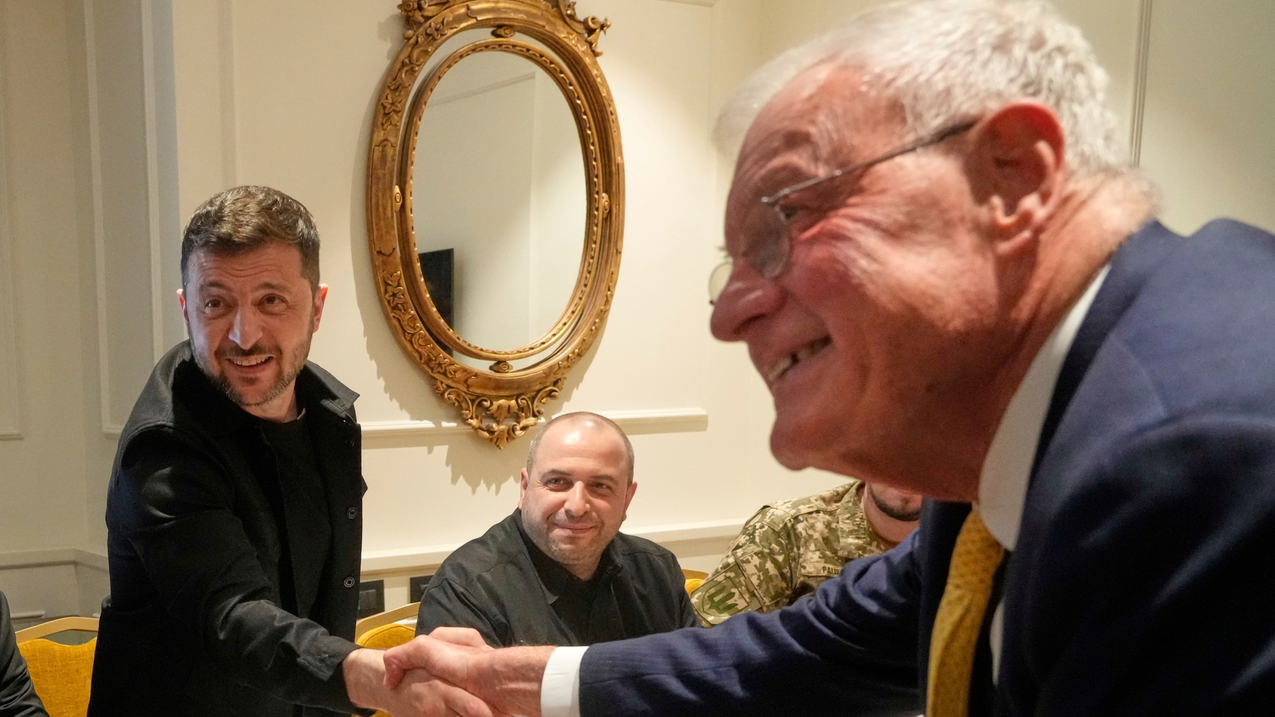 Ukraine President Volodymyr Zelenskyy, left, shakes hands with United States Special Envoy for Ukraine and Russia, Joseph Keith Kellogg, during their meeting in Rome, Italy, Wednesday, July 9, 2025. (AP Photo/Gregorio Borgia)