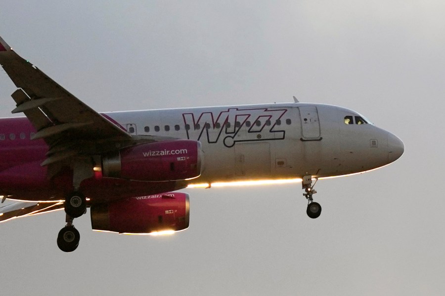 FILE - A Wizz Air Airbus A320 approaches for landing at sunset in Lisbon, Portugal, on July 20, 2024. (AP Photo/Armando Franca, File)