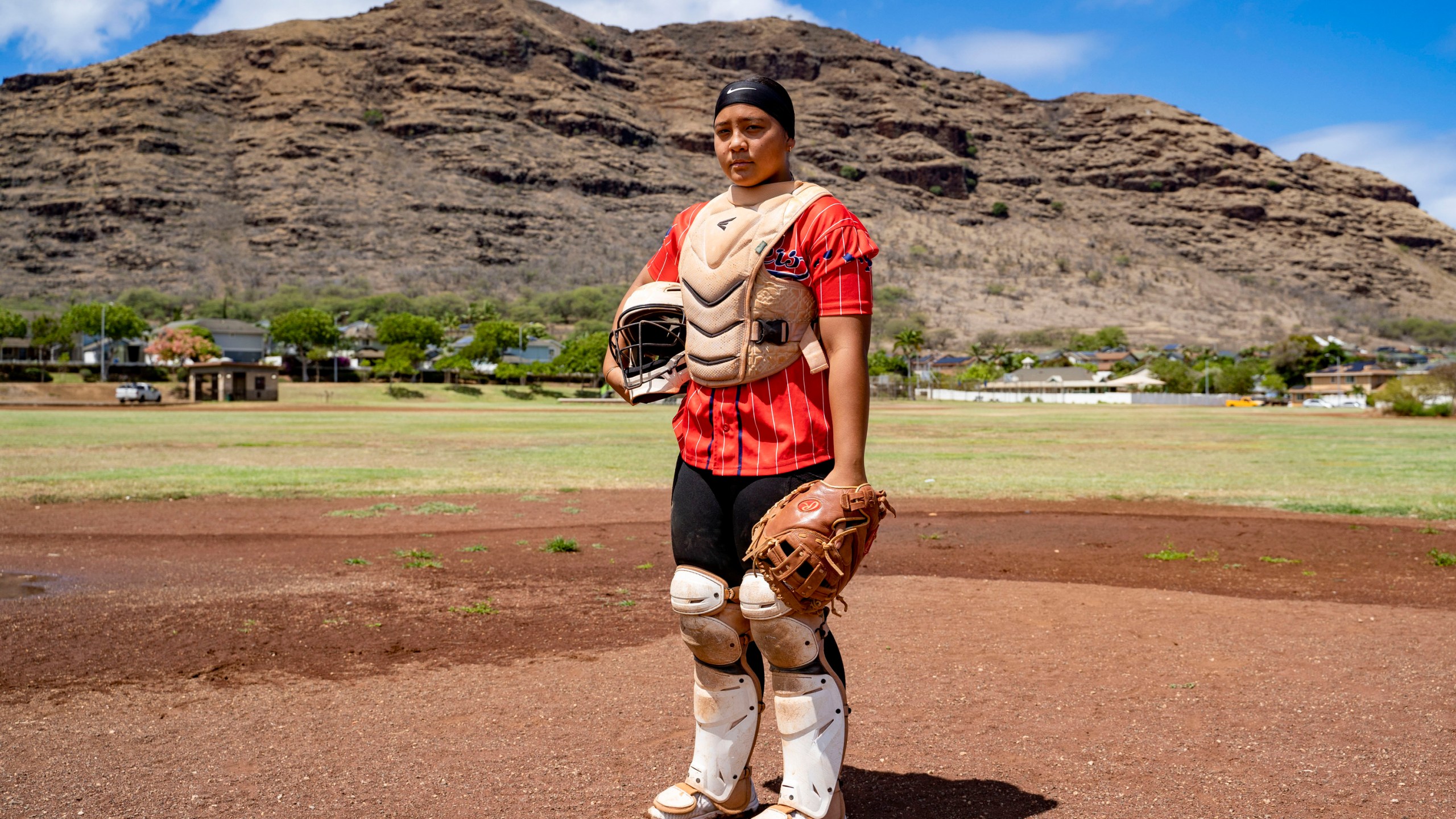 Ry-n Uyeda, 17, a senior at Waianae High School, poses for a portrait, Friday, July 11, 2025, in Waianae, Hawaii. (AP Photo/Mengshin Lin)