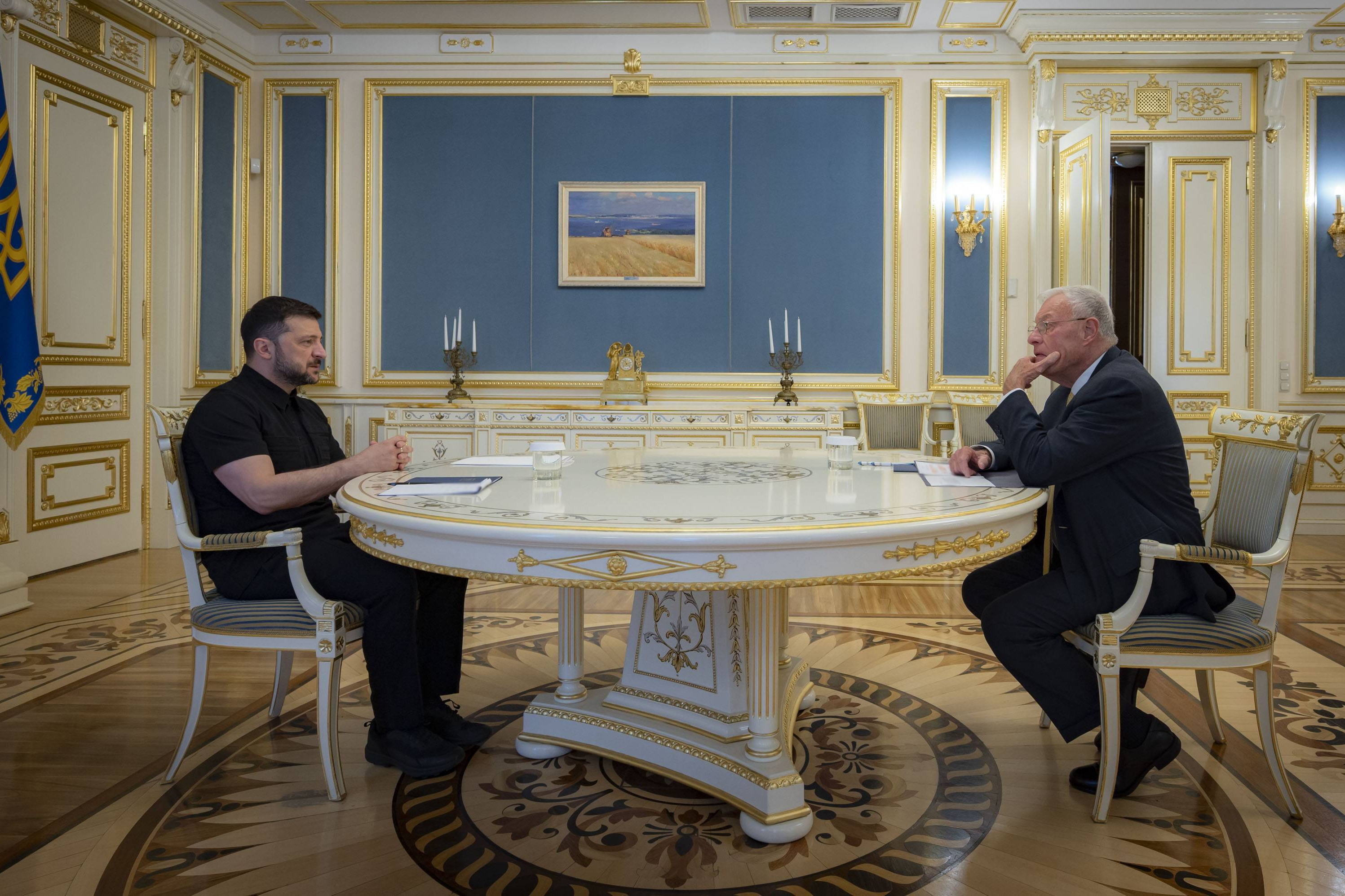 Ukrainian President Volodymyr Zelenskyy, left, and United States Special Envoy for Ukraine and Russia, Joseph Keith Kellogg talk in Kyiv, Ukraine, Monday, July 14, 2025. (Ukrainian Presidential Press Office via AP)