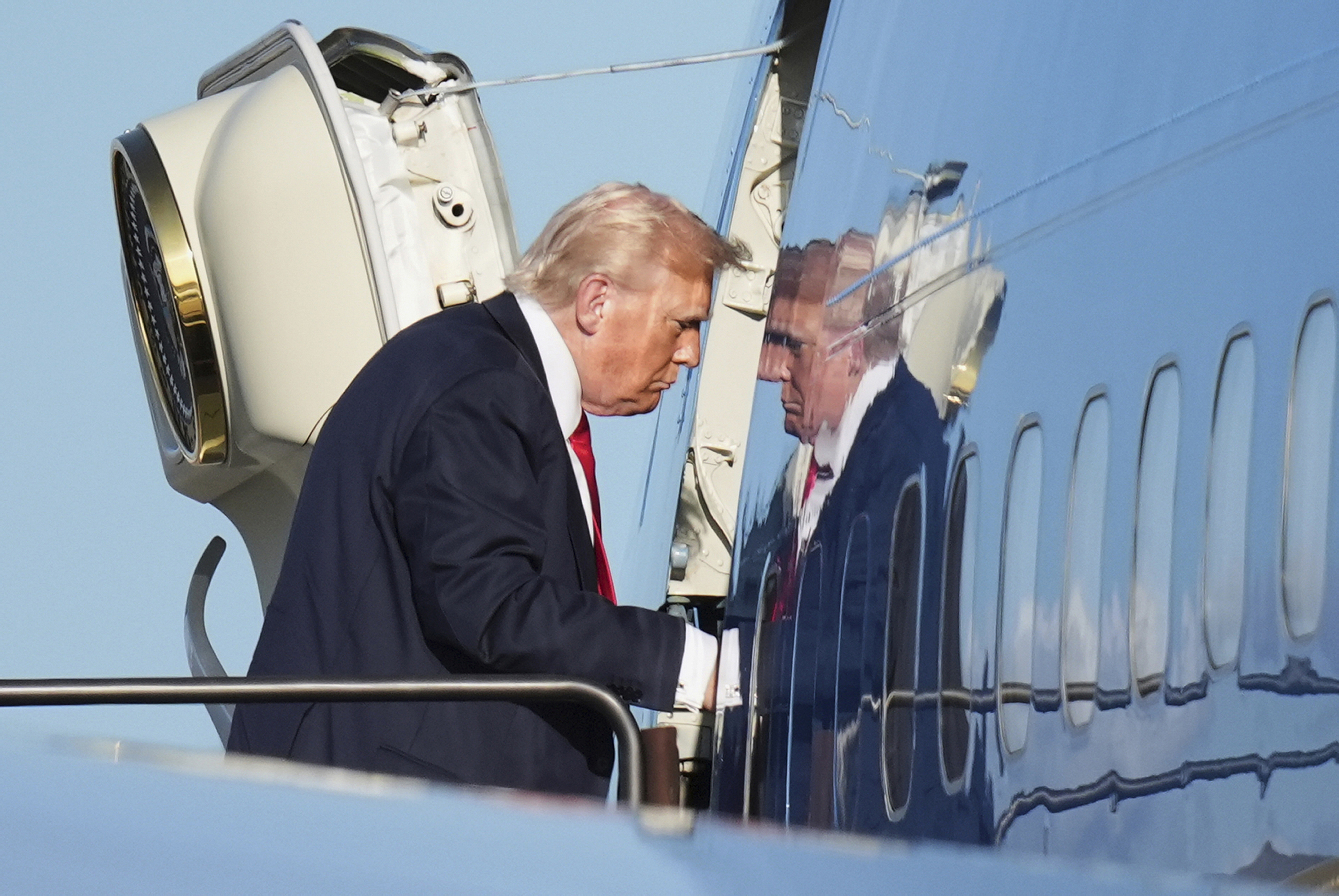 President Donald Trump boards Air Force One, Sunday, July 13, 2025, in Newark, N.J., en route to Washington. (AP Photo/Jacquelyn Martin)
