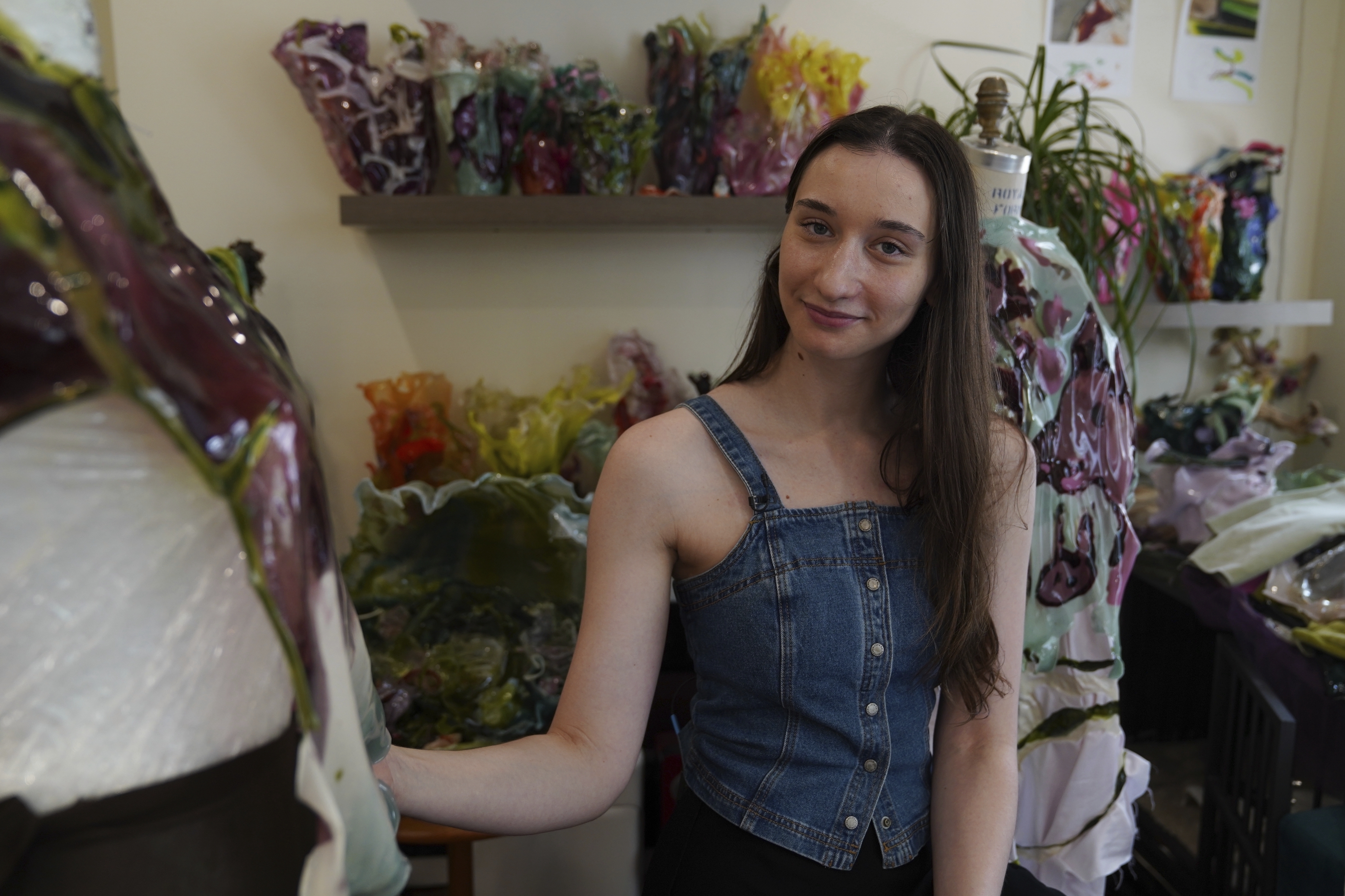 Fashion designer Caroline Zimbalist poses in her studio on Friday, June 6, 2025, in the Queens borough of New York. (AP Photo/Mary Conlon)