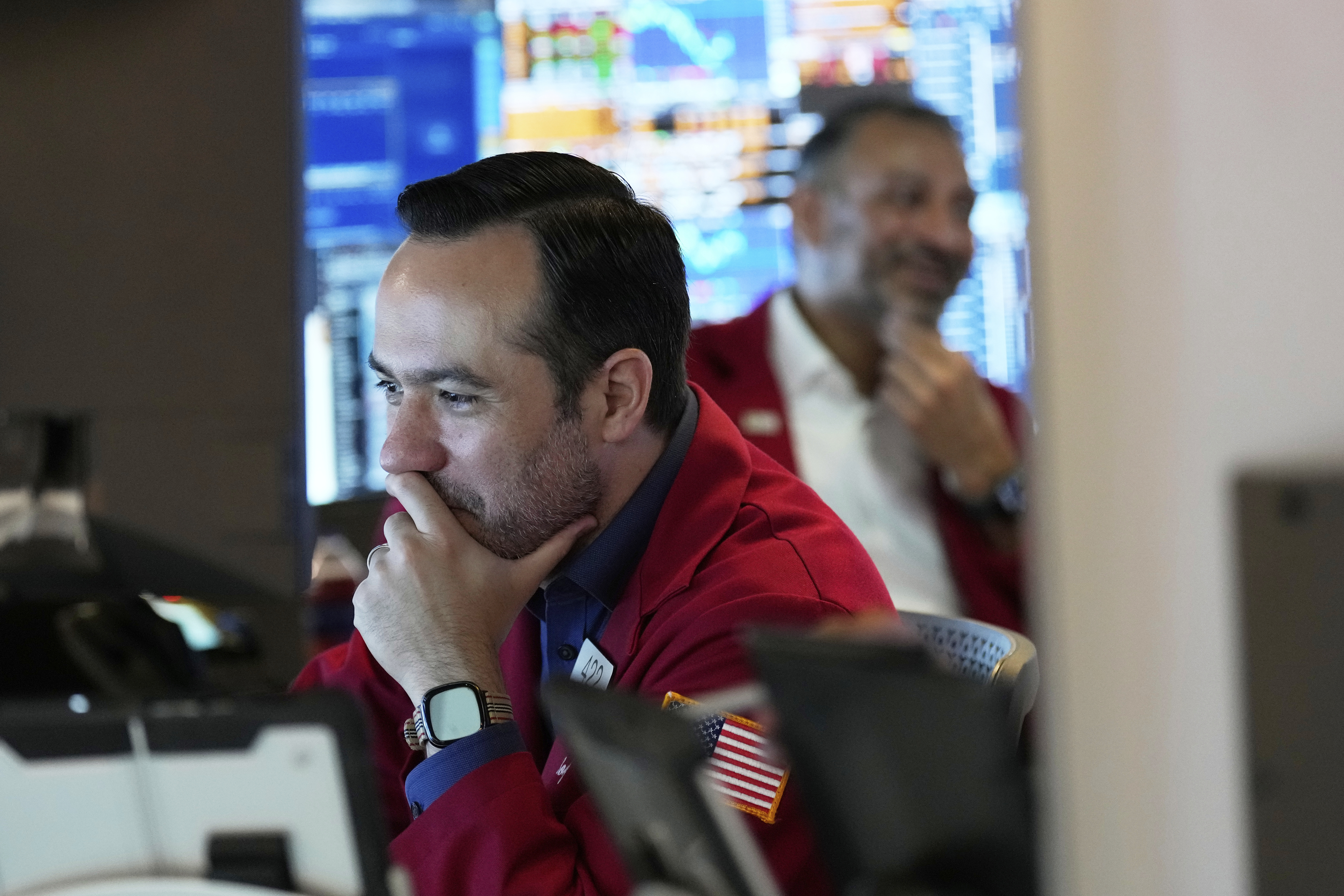 Robert Greason works on the floor at the New York Stock Exchange in New York, Monday, July 14, 2025. (AP Photo/Seth Wenig)