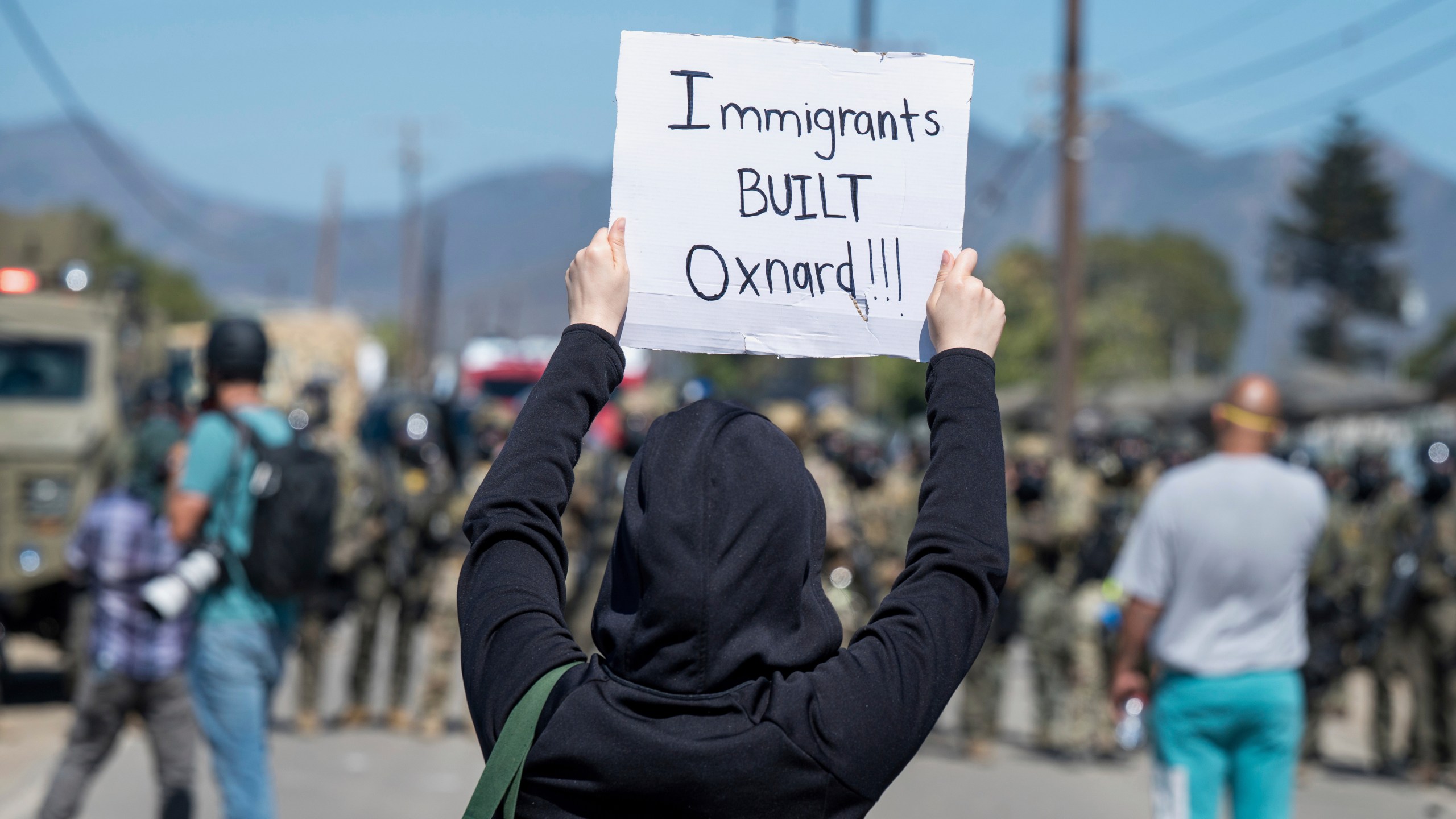 Protesters standoff against federal immigration agents during a raid in the agriculture area of Camarillo, Calif., Thursday, July 10, 2025. (AP Photo/Michael Owen Baker)