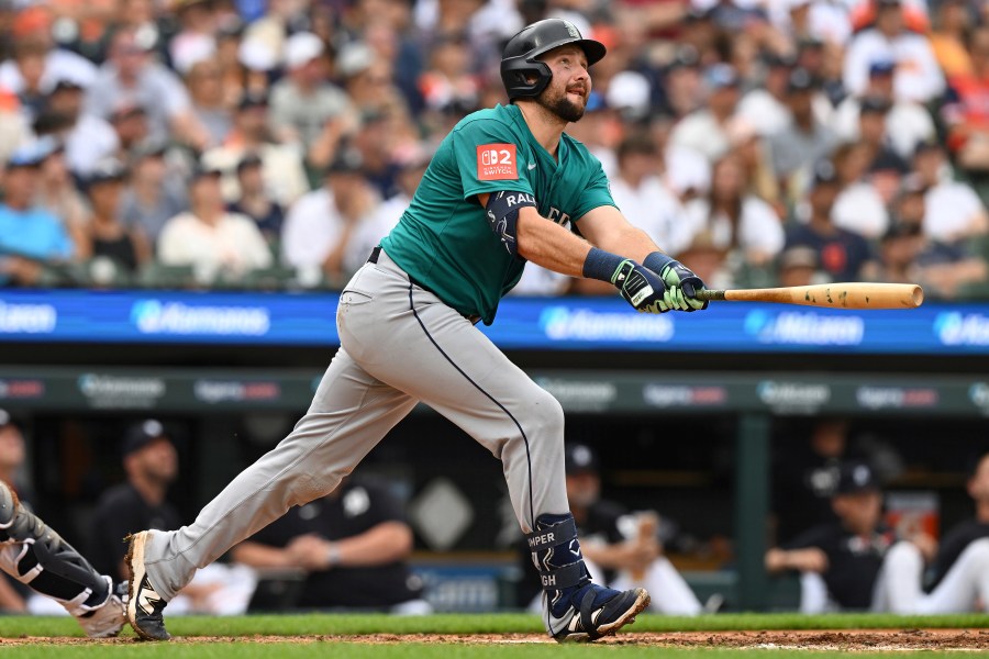 Seattle Mariners Cal Raleigh (29) hits a sacrifice fly against the Detroit Tigers in the third inning of a baseball game, Saturday, July 12, 2025, in Detroit. (AP Photo/Lon Horwedel)