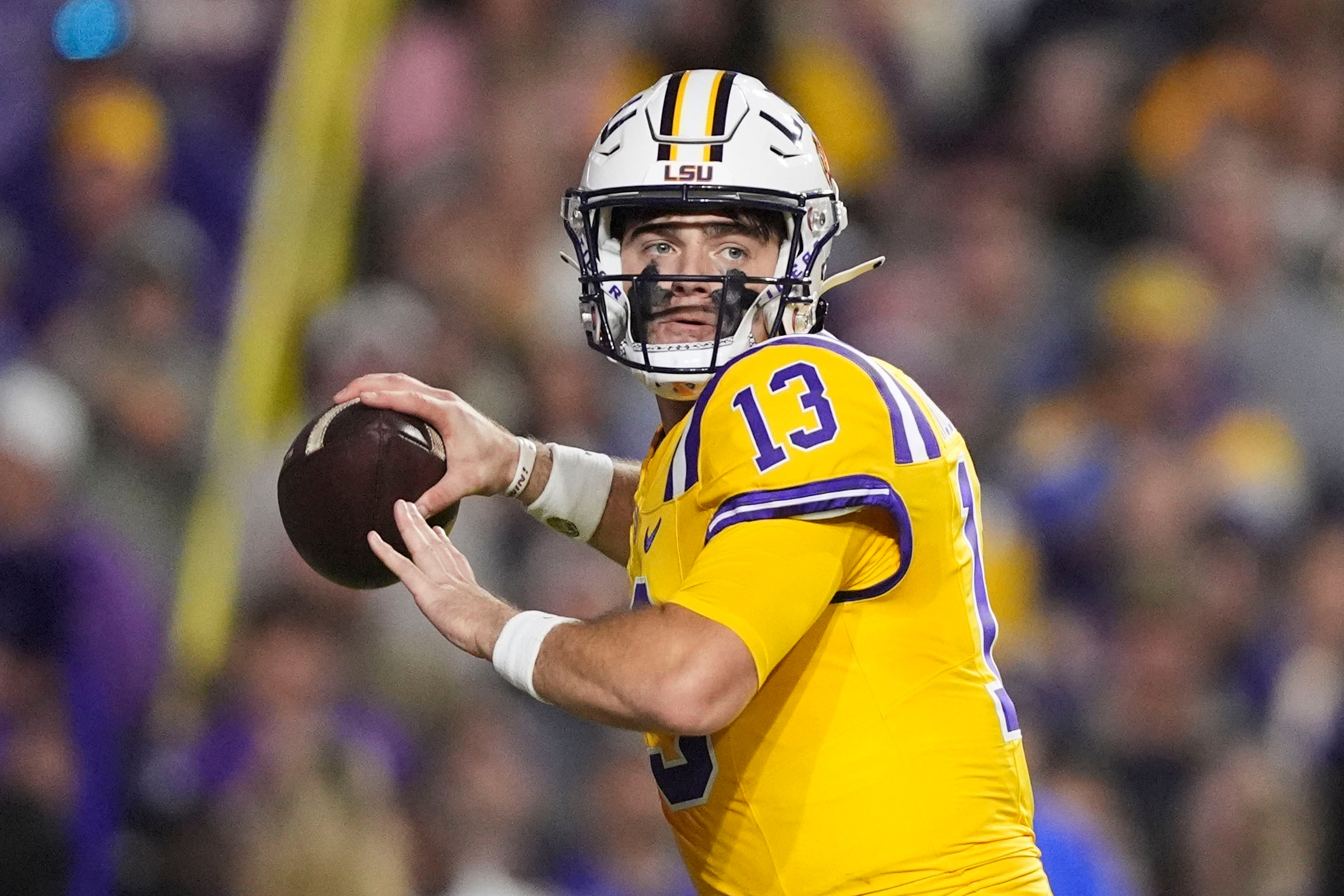 FILE - LSU quarterback Garrett Nussmeier (13) passes in the first half of an NCAA college football game against Vanderbilt in Baton Rouge, La., Saturday, Nov. 23, 2024. (AP Photo/Gerald Herbert, File)