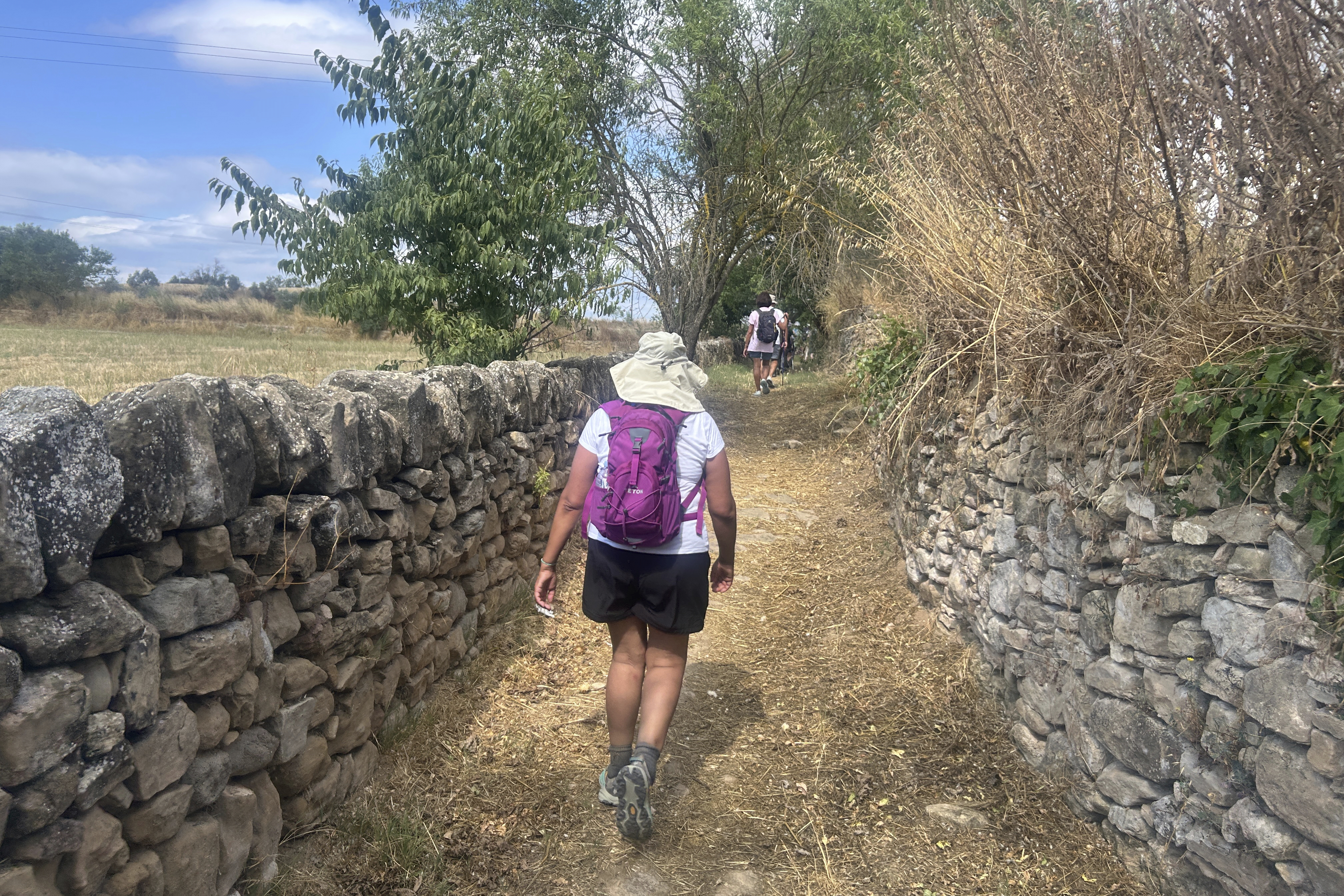 A pilgrim walks along the Ignatian Way heading towards Manresa, Spain, Wednesday, July 9, 2025. (AP Photo/Joseph Wilson)