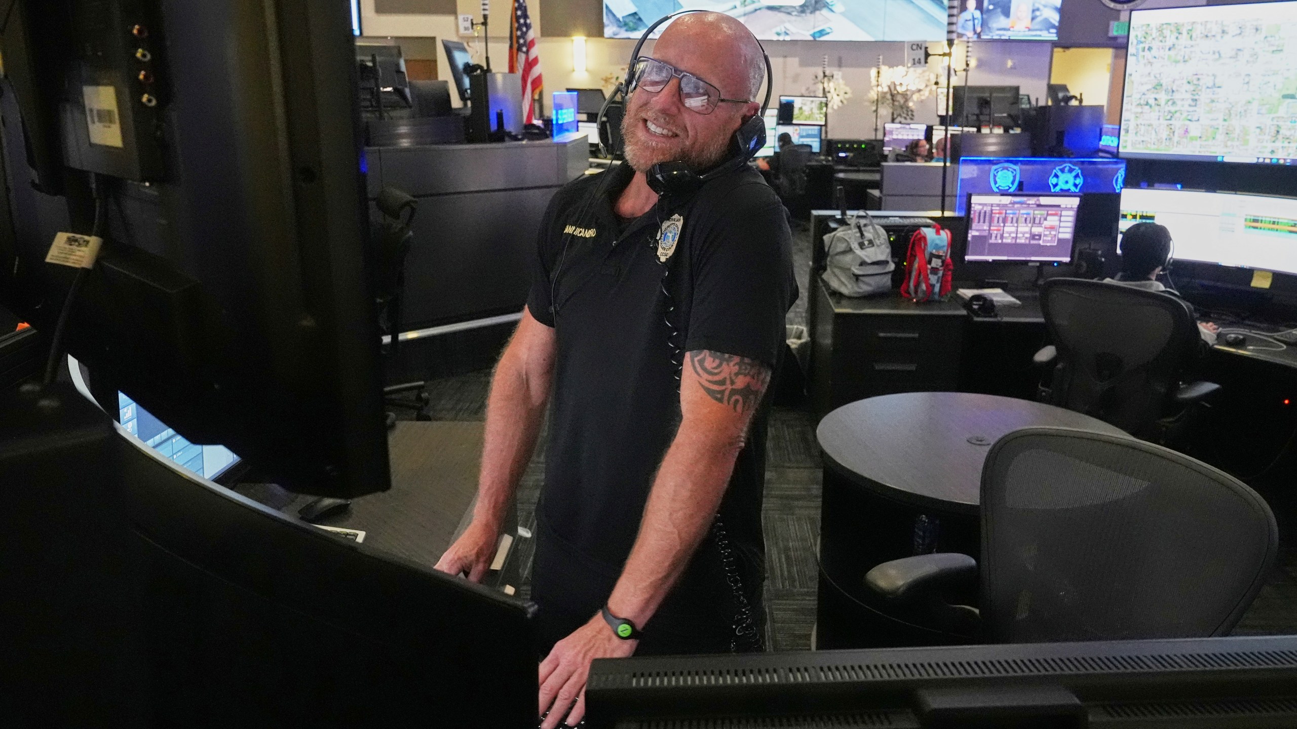 Senior dispatcher Jude Sannicandreo responds to an emergency call at the Collier County Emergency Services Center, Friday, July 11, 2025, in Naples, Fla. (AP Photo/Marta Lavandier)