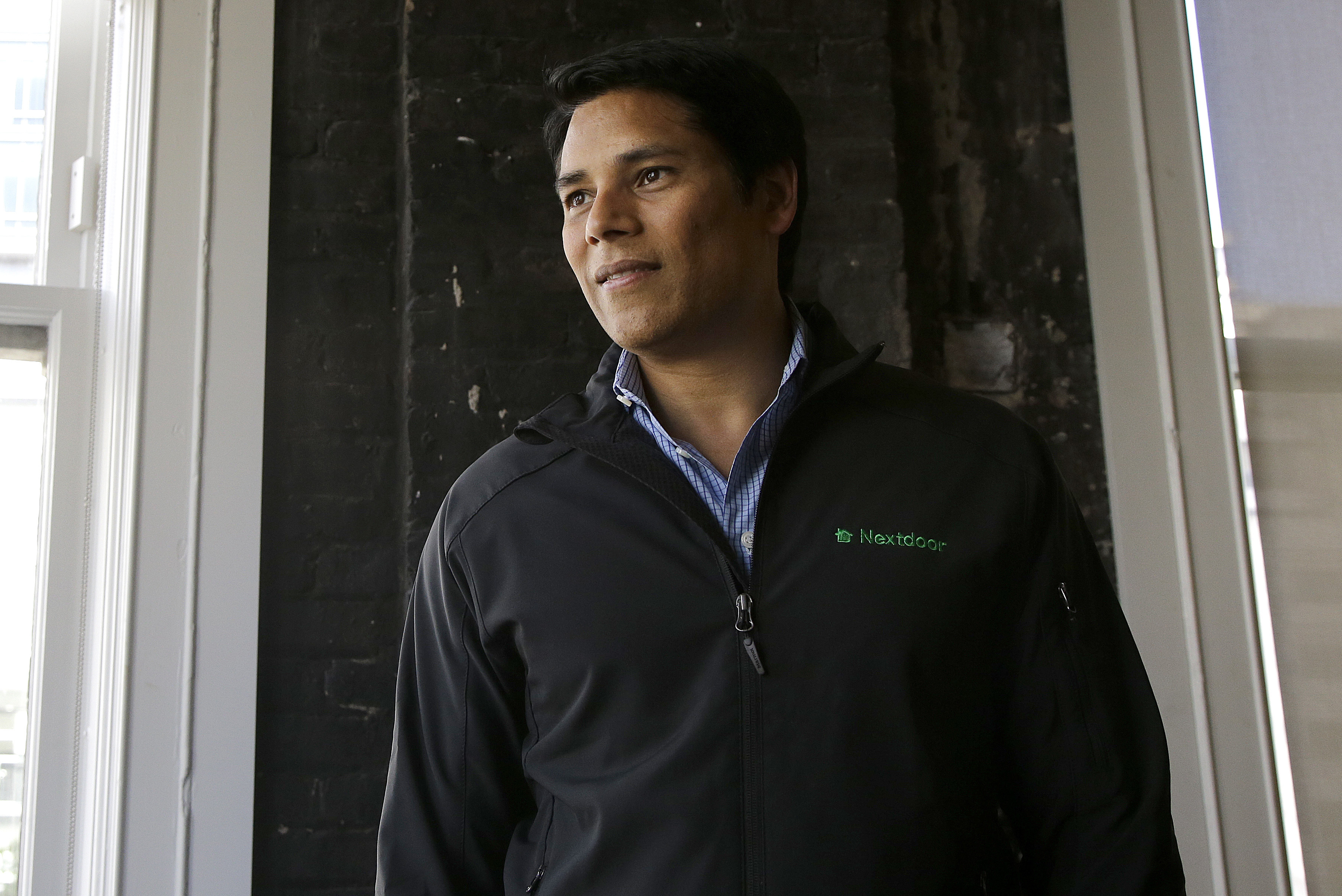 FILE - Nextdoor CEO Nirav Tolia poses for photos at his office in San Francisco on May 11, 2016. (AP Photo/Jeff Chiu, File)