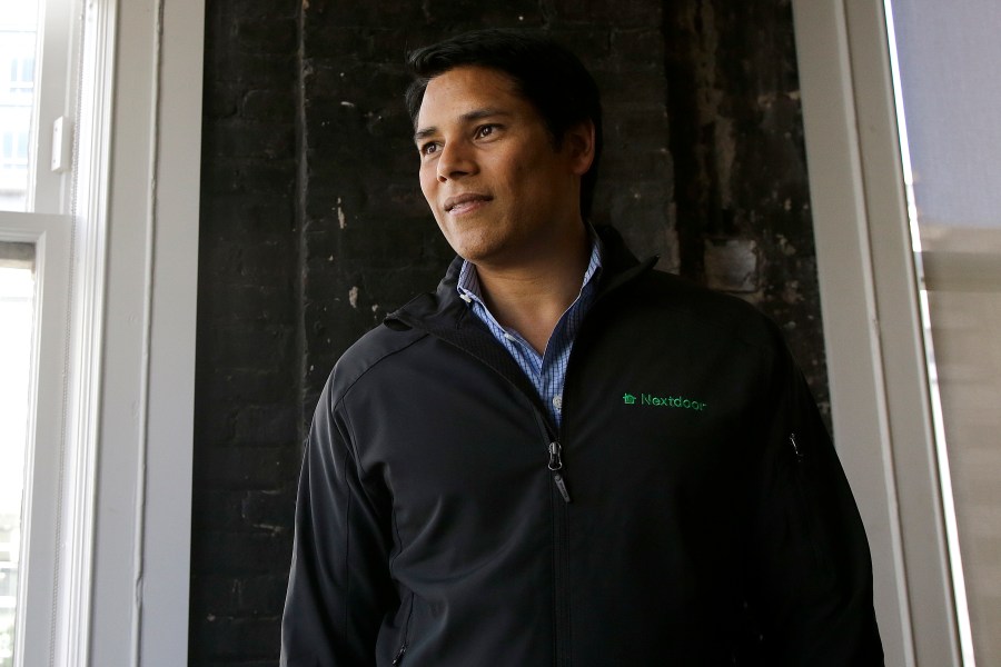 FILE - Nextdoor CEO Nirav Tolia poses for photos at his office in San Francisco on May 11, 2016. (AP Photo/Jeff Chiu, File)