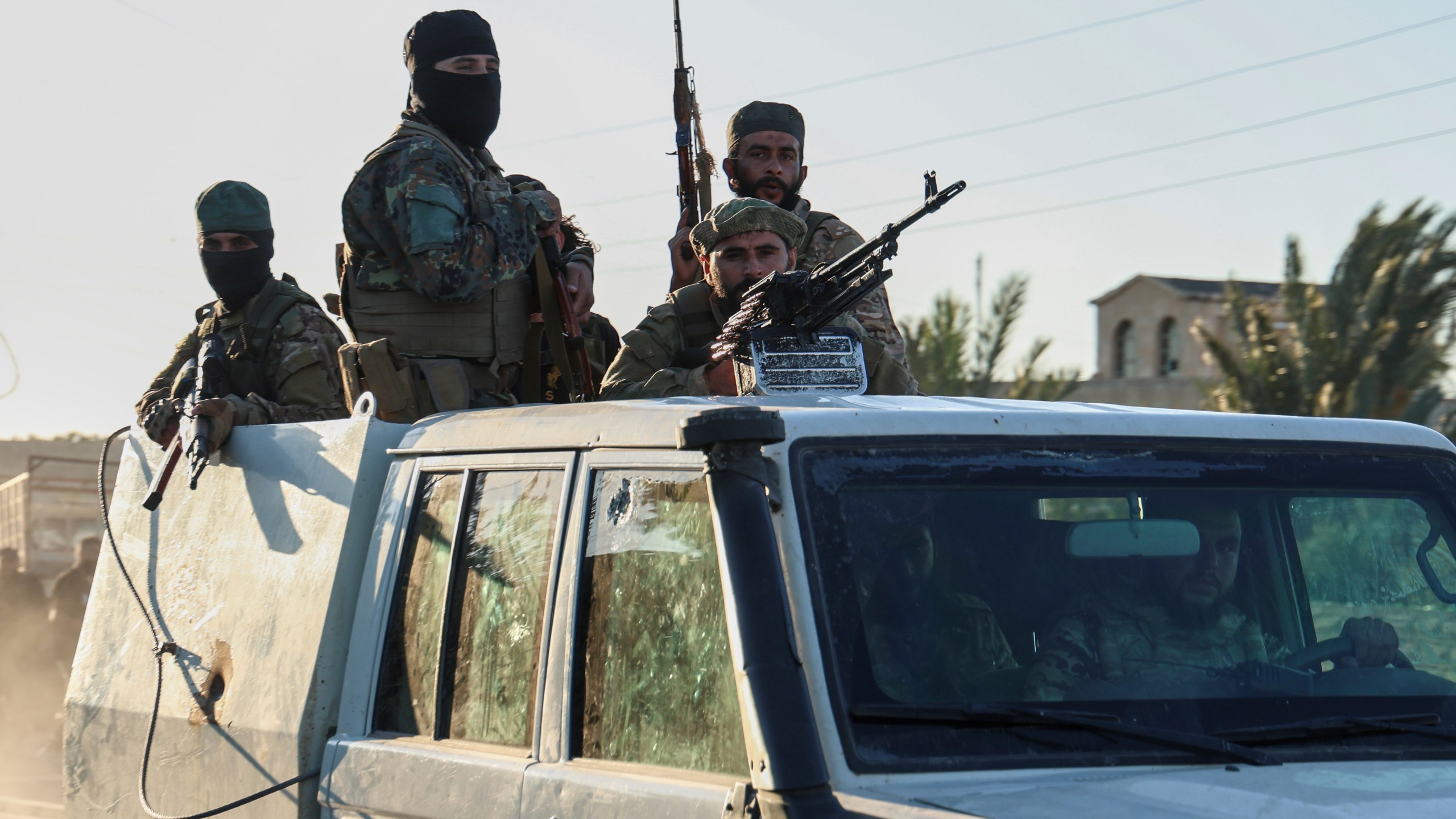 Syrian government forces deploy at the Mazraa village on the outskirts of city of Sweida, where clashes erupted between Sunni Bedouin clans and Druze militias, southern Syria, Monday, July 14, 2025. (AP Photo/Ghaith Alsayed)
