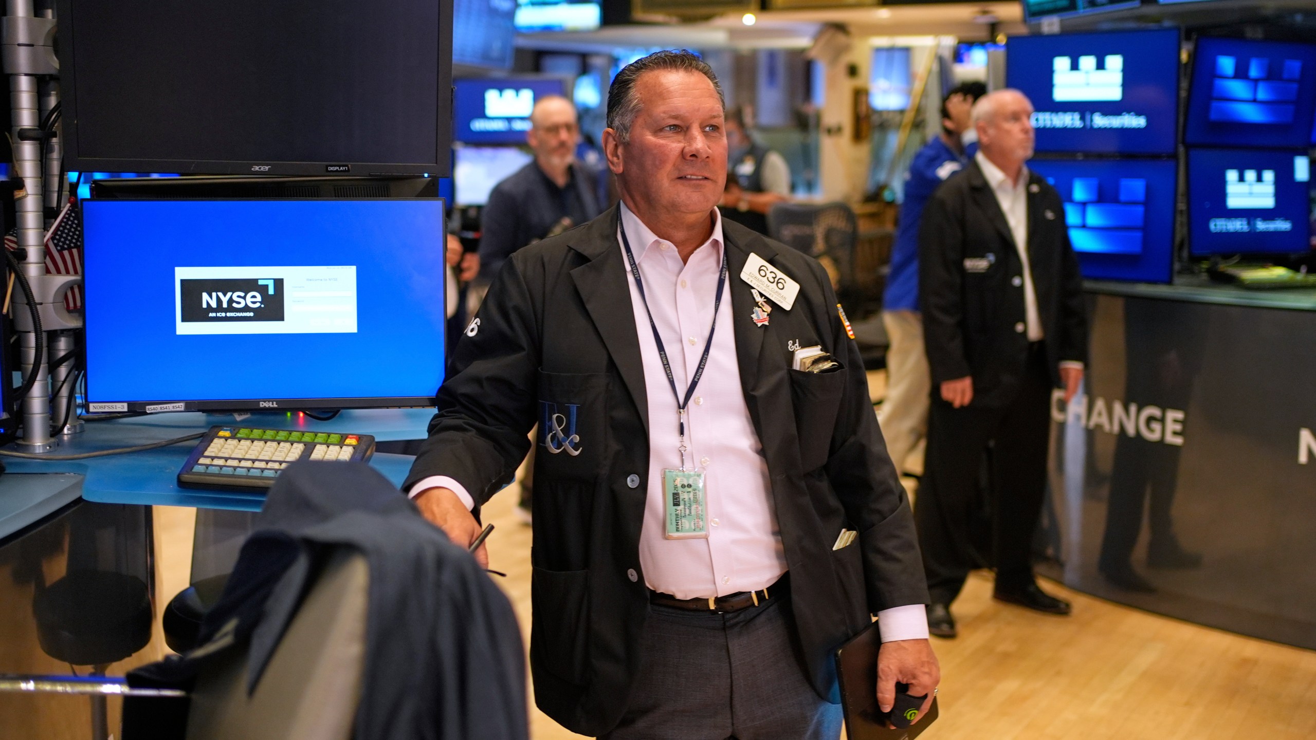 Ed Curran works on the floor at the New York Stock Exchange in New York, Monday, July 14, 2025. (AP Photo/Seth Wenig)