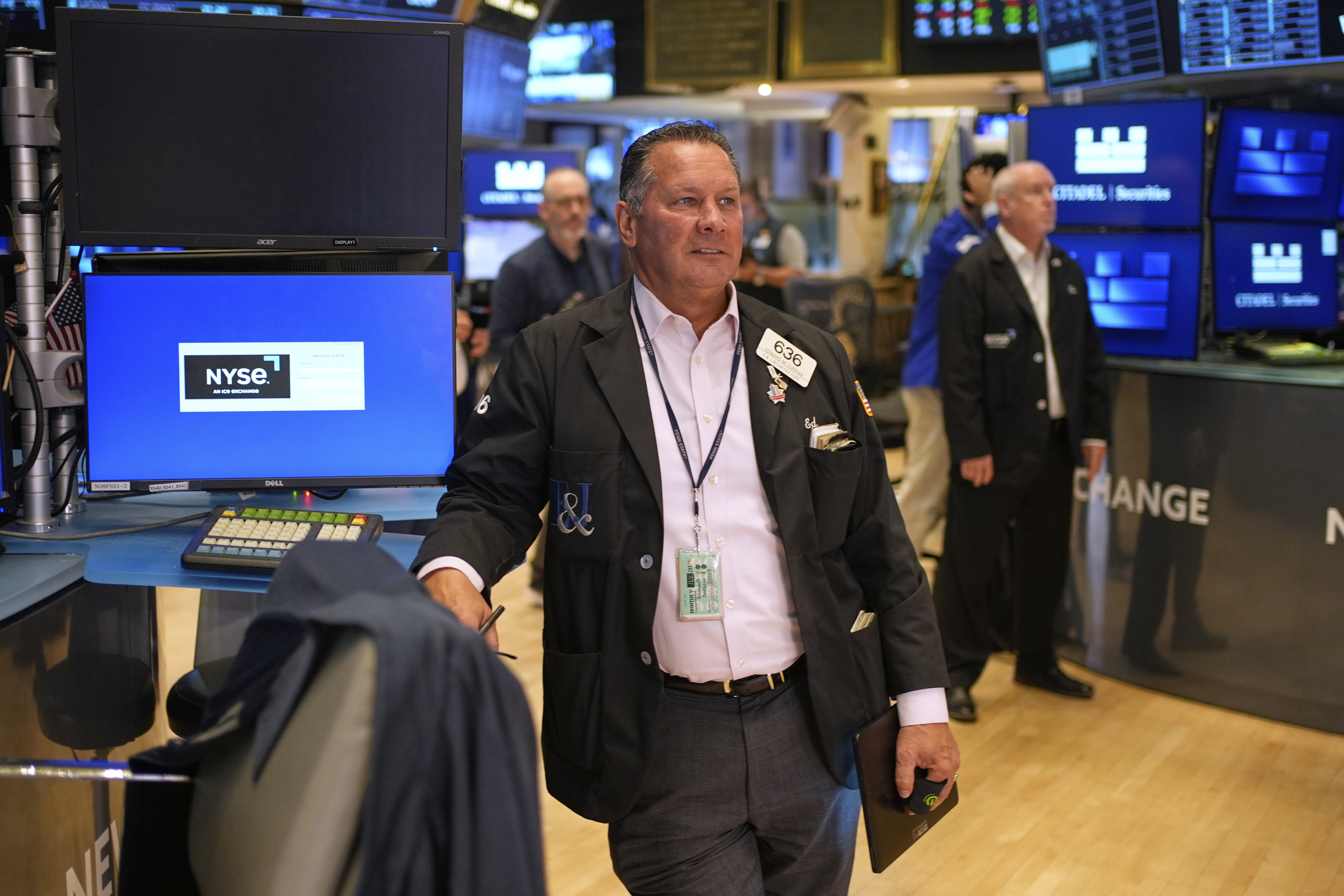 Ed Curran works on the floor at the New York Stock Exchange in New York, Monday, July 14, 2025. (AP Photo/Seth Wenig)