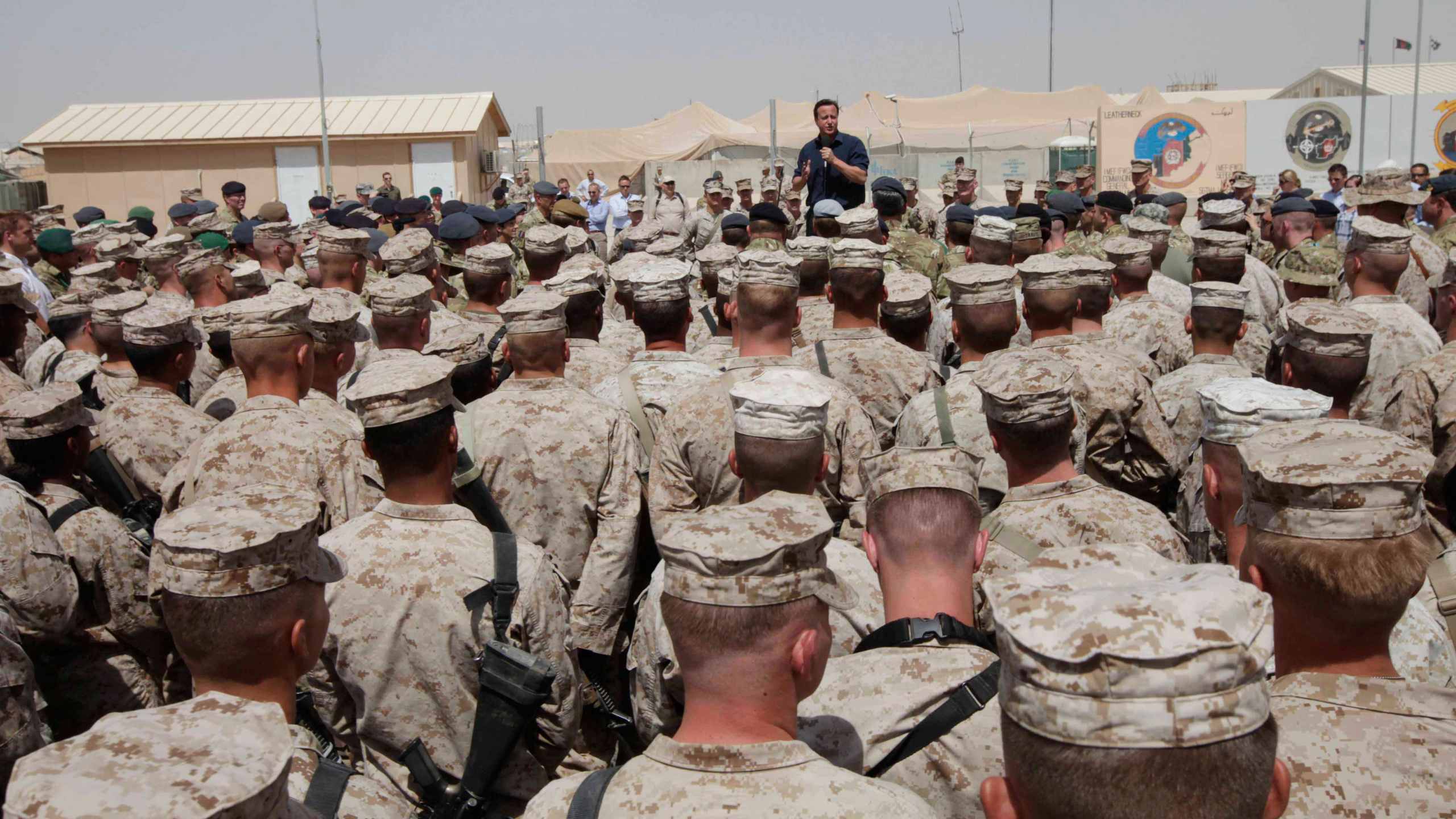 FILE - Britain's Prime Minister David Cameron delivers a speech to British and US troops during a visit to Camp Bastion, outside Lashkar Gah, the provincial capital of Helmand province in south Afghanistan, July 4, 2011. (AP Photo/Lefteris Pitarakis, pool, file)