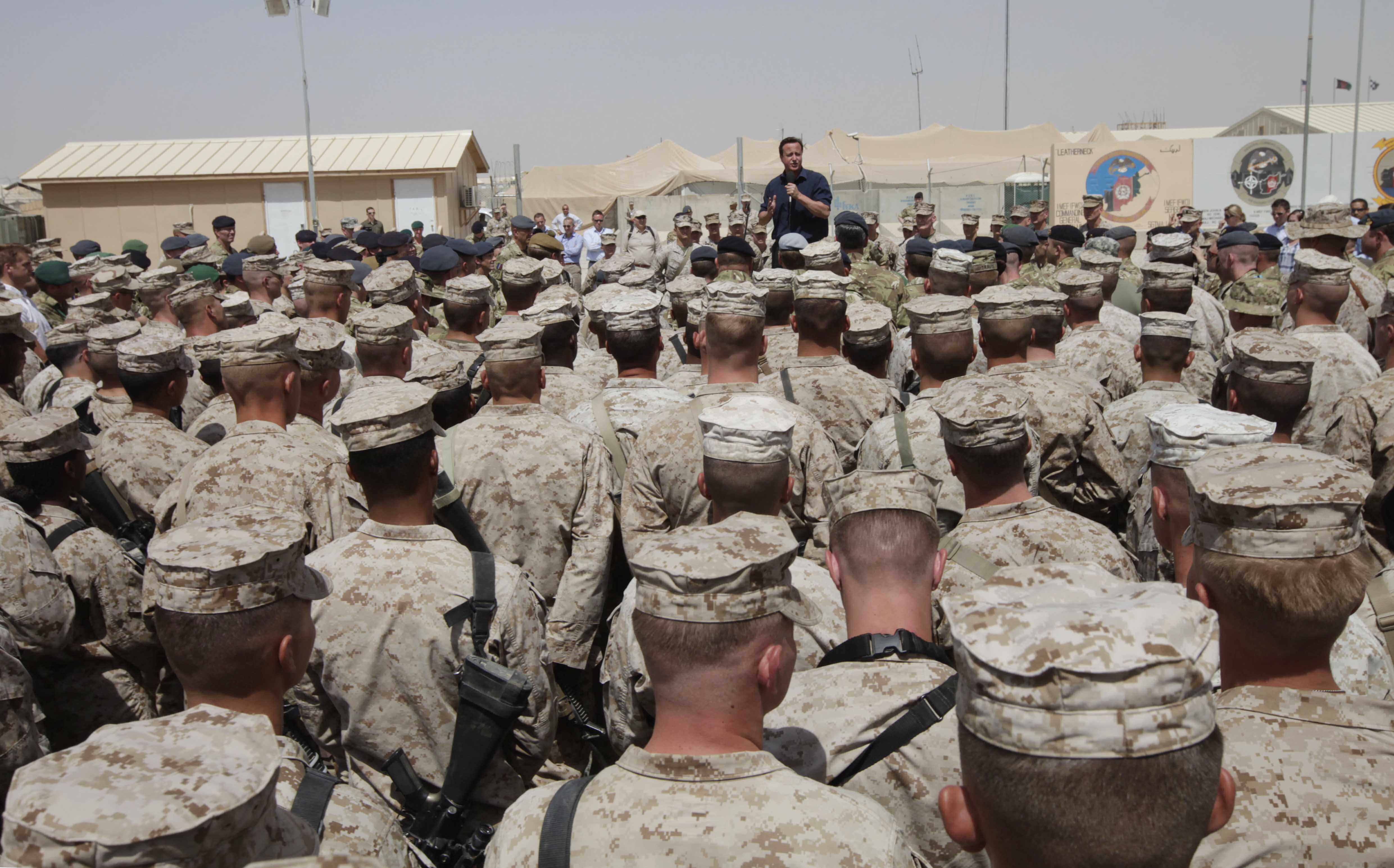 FILE - Britain's Prime Minister David Cameron delivers a speech to British and US troops during a visit to Camp Bastion, outside Lashkar Gah, the provincial capital of Helmand province in south Afghanistan, July 4, 2011. (AP Photo/Lefteris Pitarakis, pool, file)
