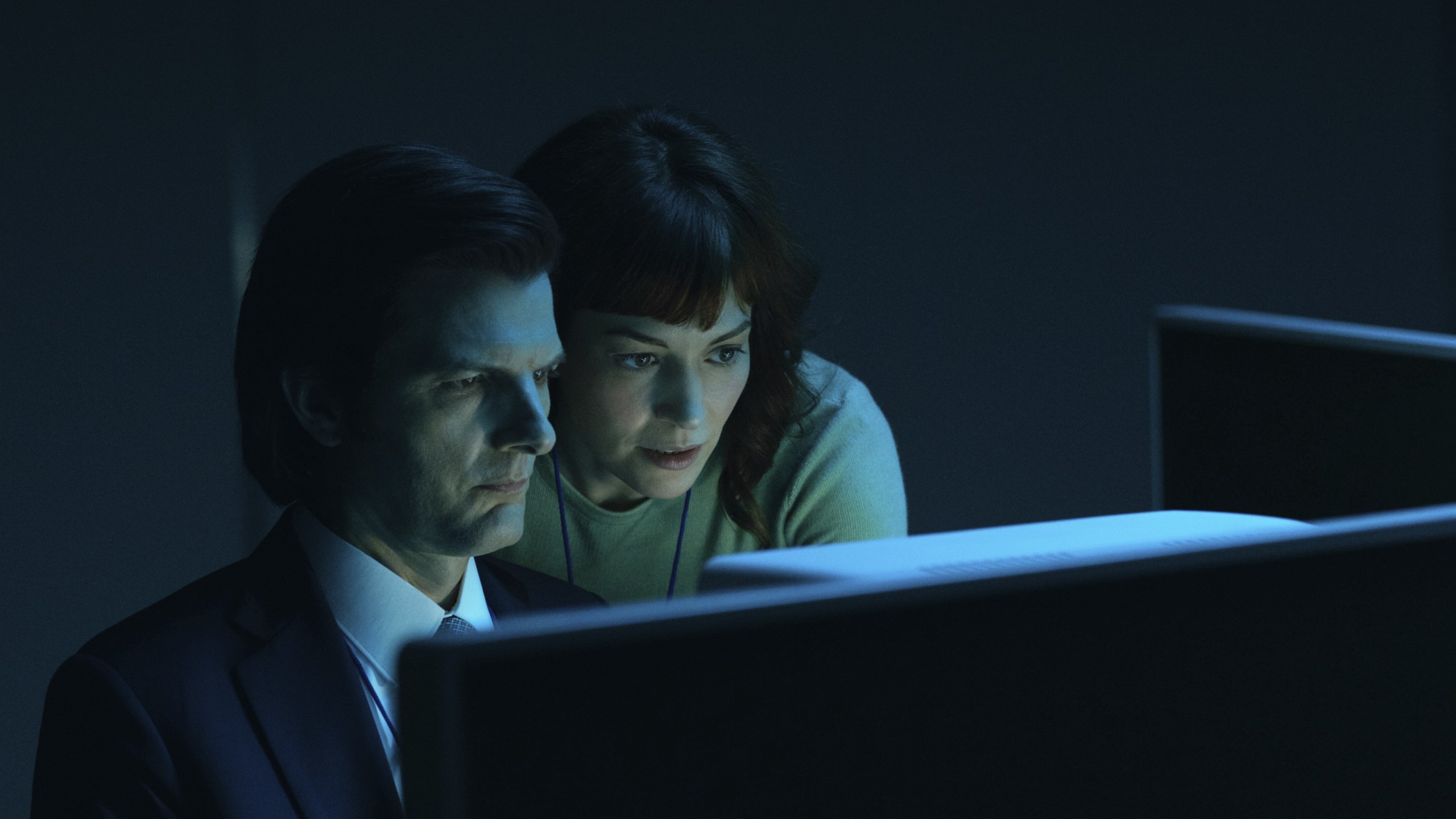 This image released by Apple TV+. shows Adam Scott, left, and Britt Lower in a scene from "Severance." (Apple TV+ via AP)