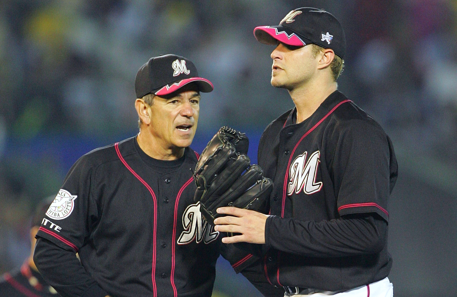 FILE - Chiba Lotte Marines manager Bobby Valentine, left, talks with his starter Dan Serafini, formerly of the Cincinnati Reds, during the fifth inning of Game Four in the Japan Series baseball game against the Hanshin Tigers at Koshien Stadium in Nishinomiya, western Japan, Wednesday, Oct. 26, 2005. (AP Photo/Shizuo Kambayashi, File)