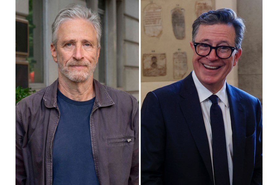 This photo combination shows Jon Stewart, left, posing for a photo outside the Department of Veterans Affairs, July 26, 2024, in Washington and Stephen Colbert being interviewed at The Vatican, June 14, 2024. (AP Photo/Kevin Wolf, Riccardo De Luca)