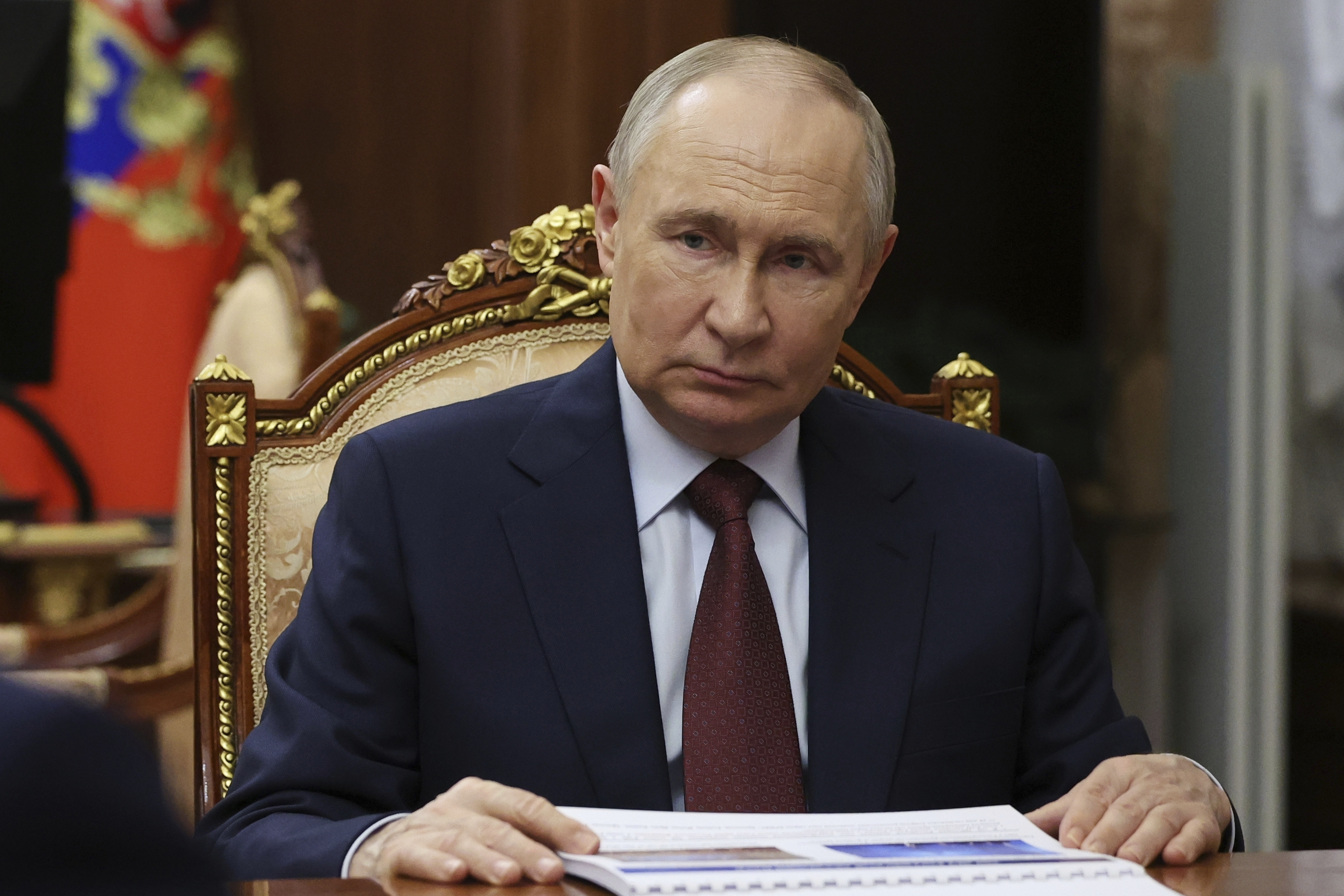 Russian President Vladimir Putin listens to Russian Academy of Sciences President Gennady Krasnikov during their meeting at the Kremlin in Moscow, Russia, Tuesday, July 15, 2025. (Mikhail Metzel, Sputnik, Kremlin Pool Photo via AP)