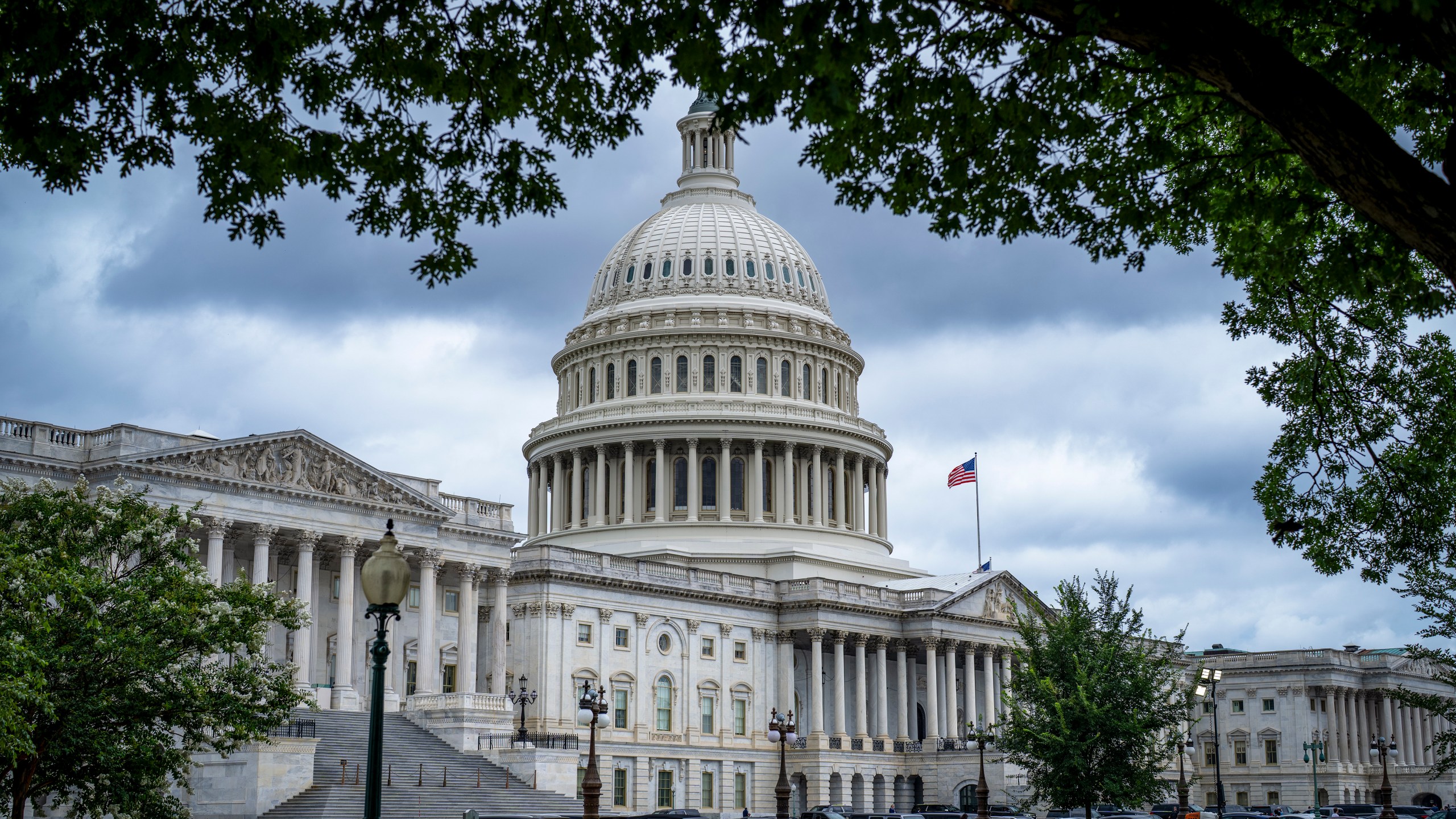The Capitol is seen under dark skies in Washington, Tuesday, July 15, 2025. (AP Photo/J. Scott Applewhite)