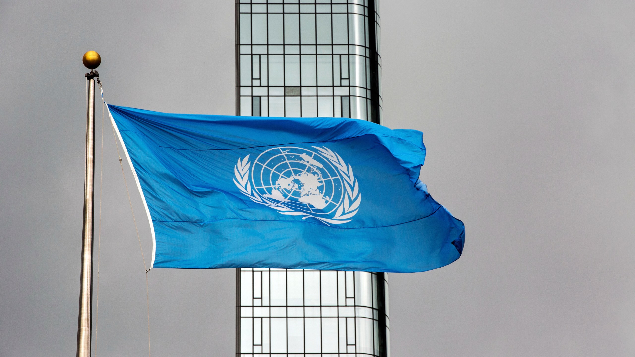 FILE - The United Nations flag flies on a stormy day at the U.N. during the United Nations General Assembly, Sept. 22, 2022. (AP Photo/Ted Shaffrey, File)