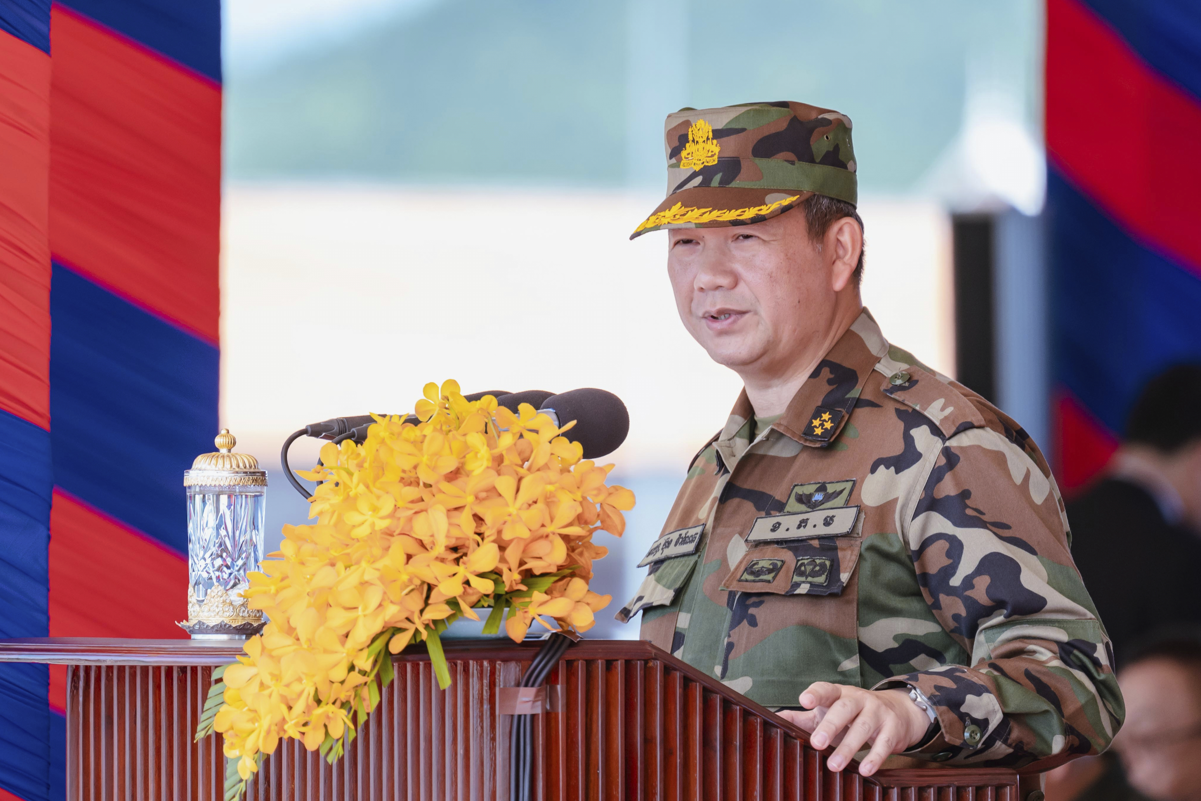 In this photo released by Agence Kampuchea Press (AKP), Cambodian Prime Minister Hun Manet delivers a speech during ceremony to put in used the military building in northern Kampong Chhnang province, Monday, July 14, 2025. (AKP via AP)