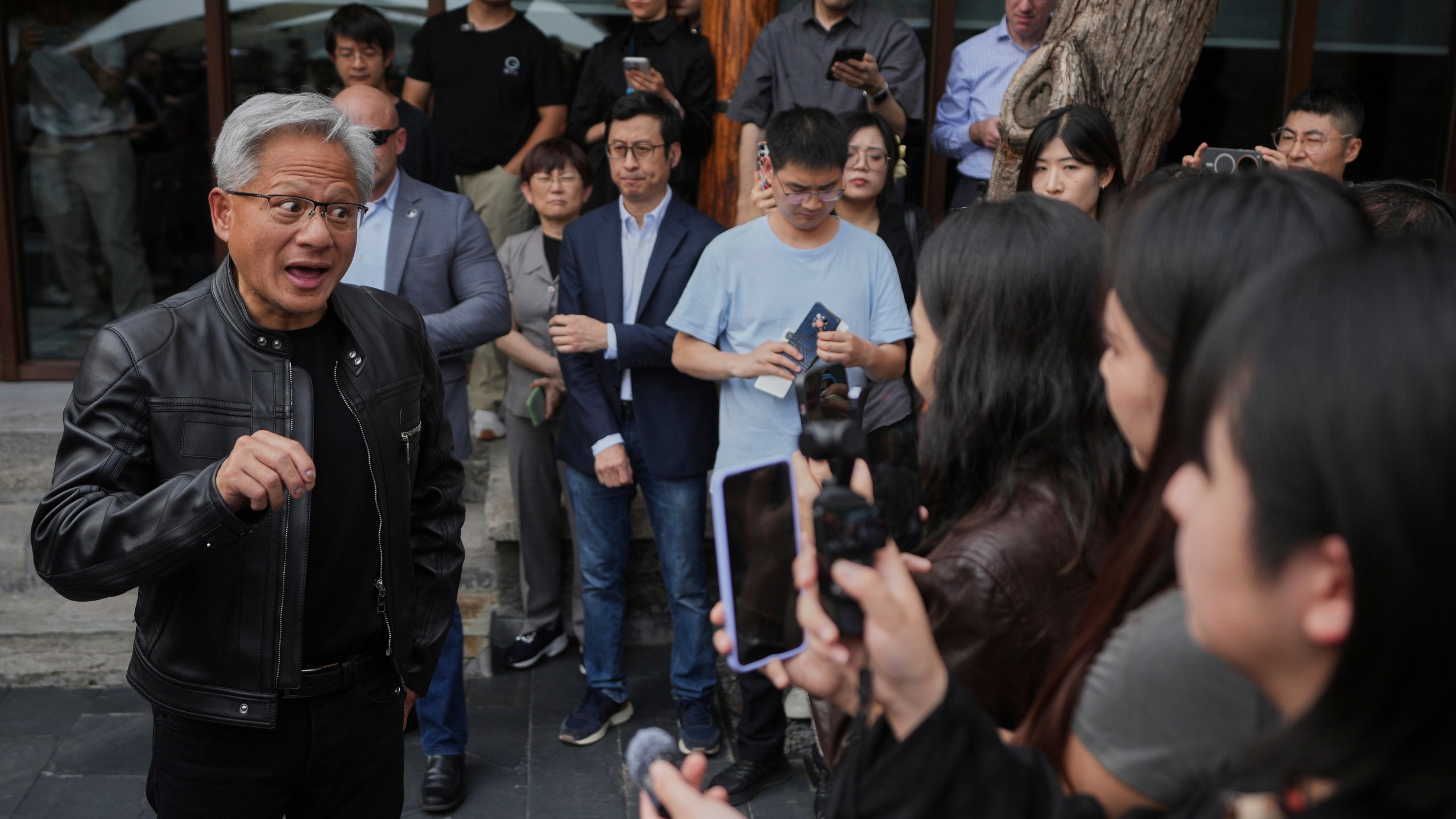 CEO of Nvidia Jensen Huang speaks to journalists during a press conference at the Mandarin Oriental Qianmen after attending the third China International Supply Chain Expo, in Beijing, Wednesday, July 16, 2025. (AP Photo/Andy Wong)