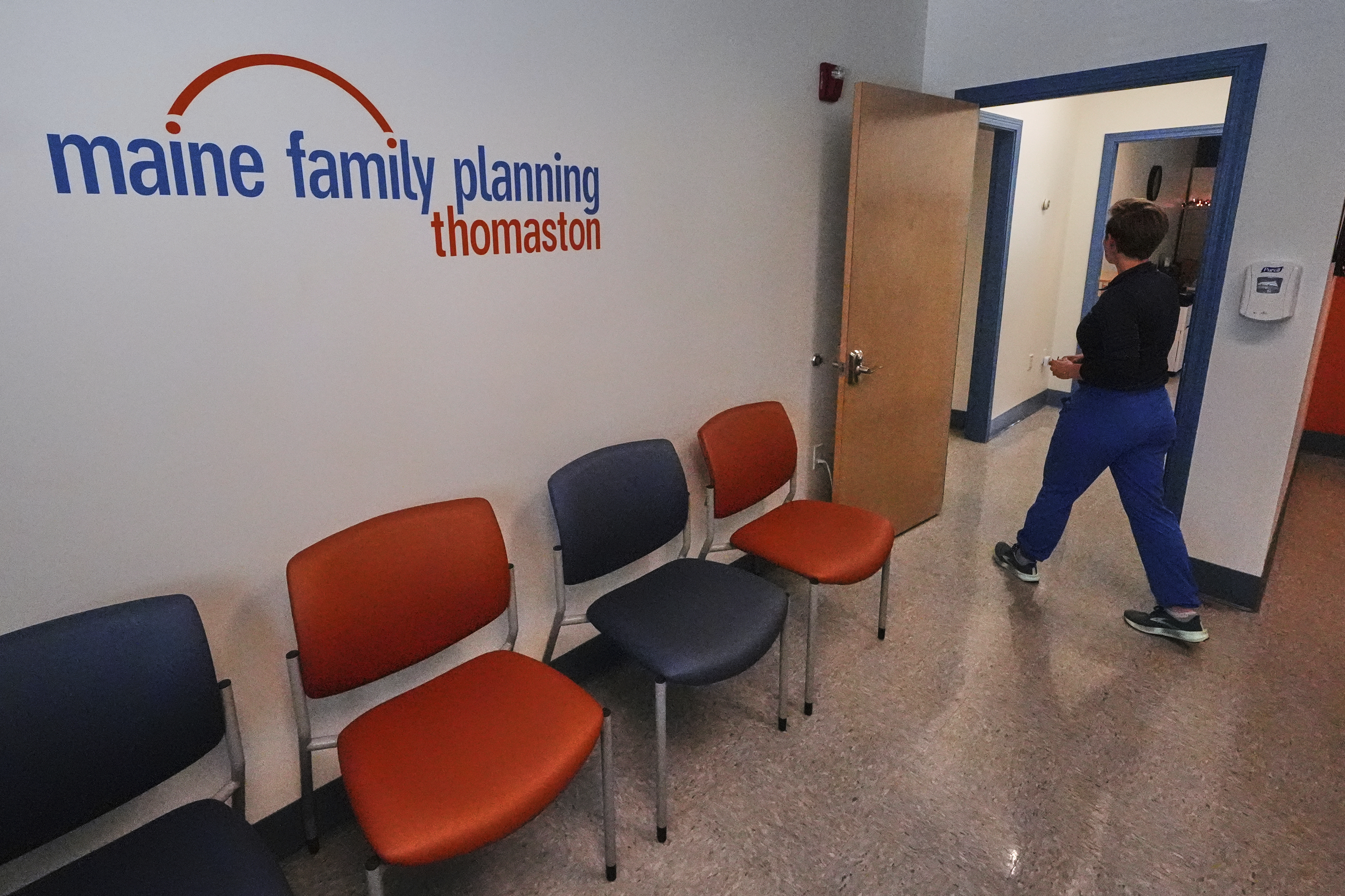 Vanessa Shields-Haas, a nurse practitioner, walks from the lobby toward the examination rooms at the Maine Family Planning healthcare facility, July 15, 2025, in Thomaston, Maine. (AP Photo/Charles Krupa)