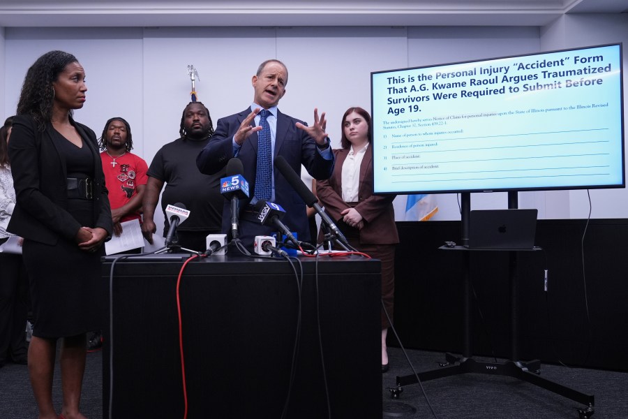 Jerome Block, partner, Levy & Konigsberg LLP, right, talks to media as attorney Kristen Feden, 1st left, listens to him during a news conference in Chicago, Wednesday, July 16, 2025. (AP Photo/Nam Y. Huh)