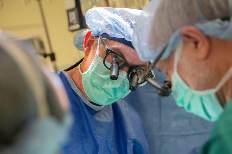 This photo provided by DukeHealth shows surgeon Joseph Turek during pediatric heart surgery in Durham, N.C., in 2021 (Shawn Rocco/DukeHealth via AP)
