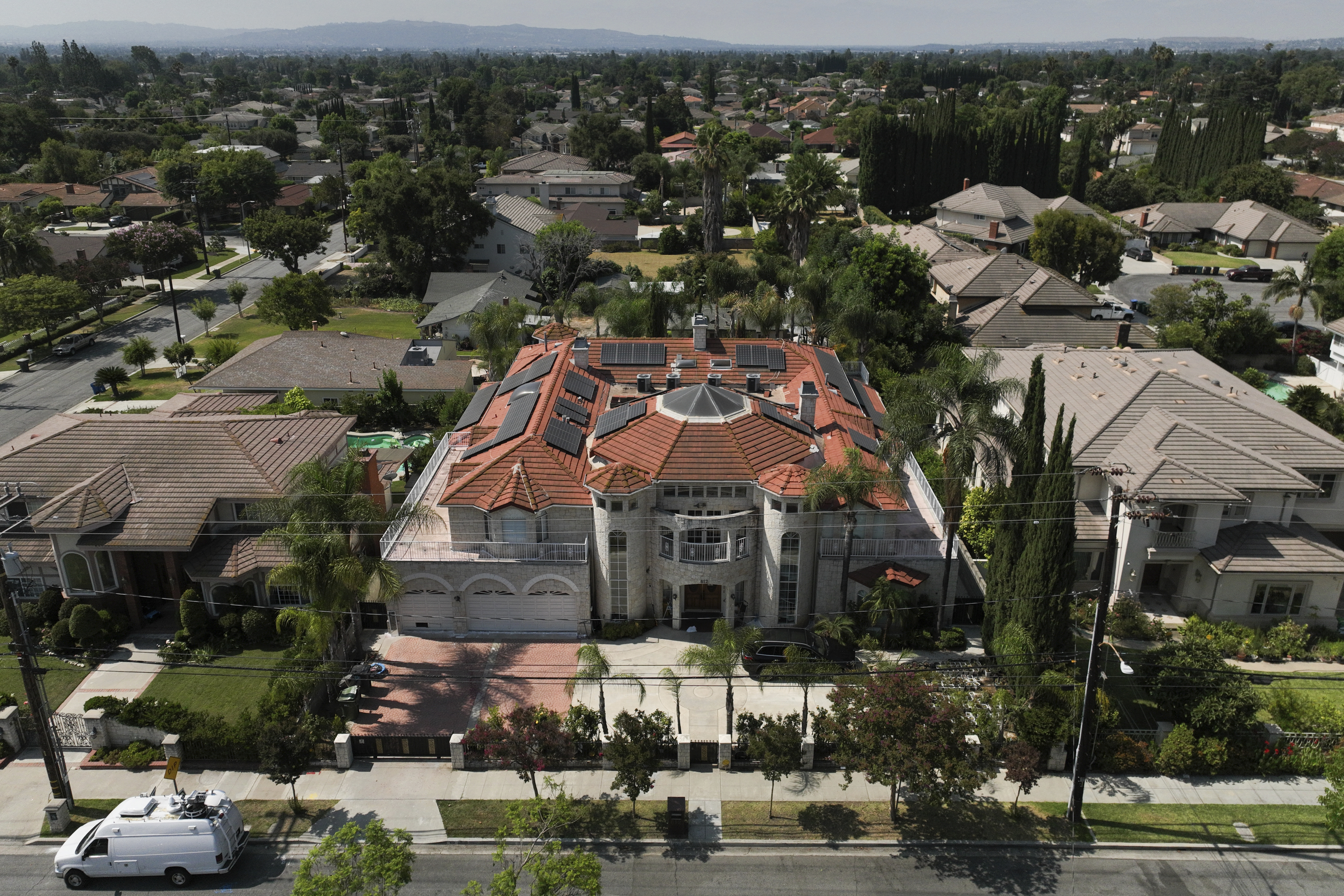 An aerial view shows the home of Silvia Zhang and Guojun Xuan on Wednesday, July 16, 2025, in Arcadia, Calif., where a number of children were removed from the couple's home after a child abuse allegation in May, according to Arcadia police. (AP Photo/Jae C. Hong)