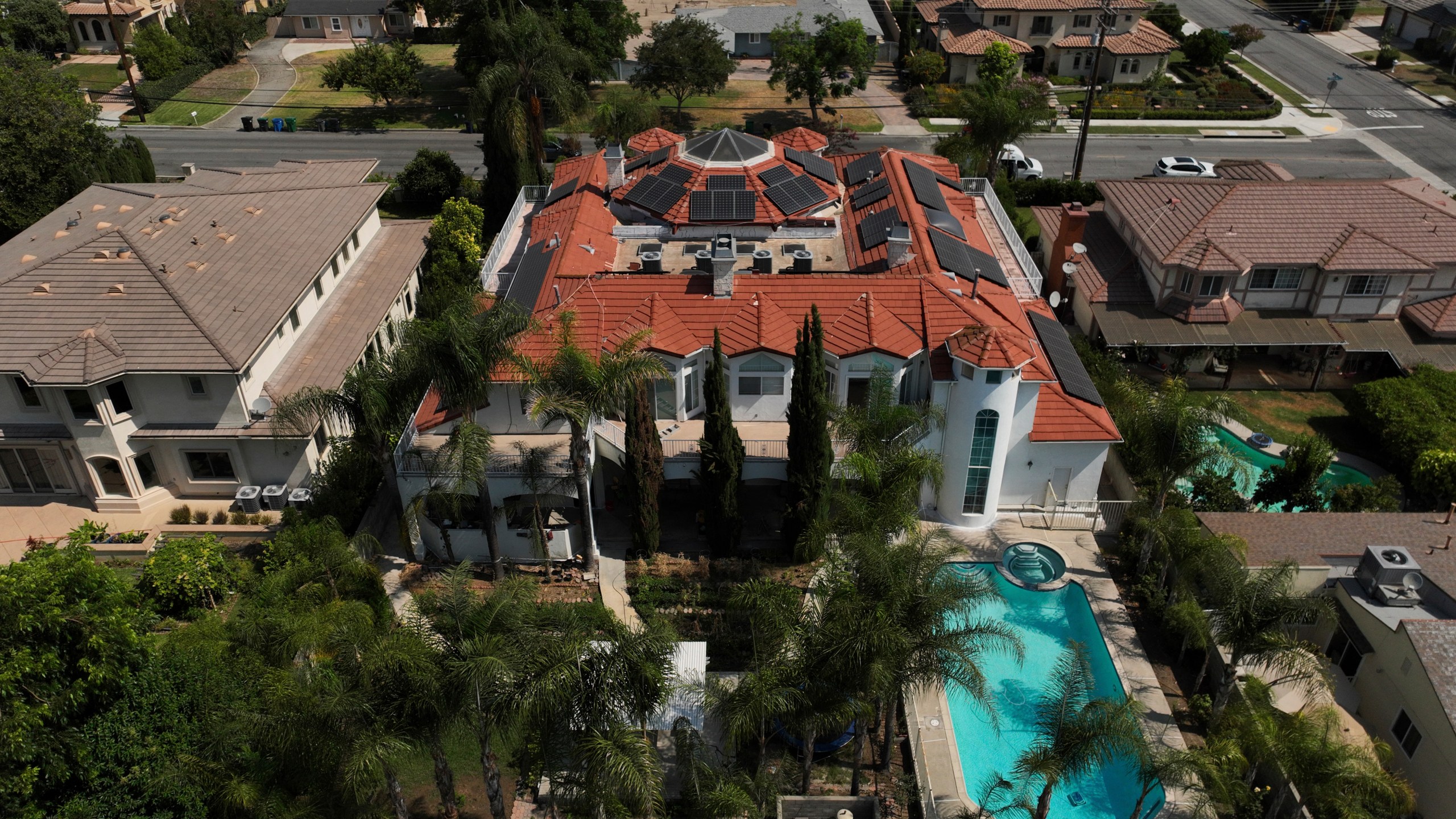 An aerial view shows the home of Silvia Zhang and Guojun Xuan on Wednesday, July 16, 2025, in Arcadia, Calif., where a number of children were removed from the couple's home after a child abuse allegation in May, according to Arcadia police. (AP Photo/Jae C. Hong)