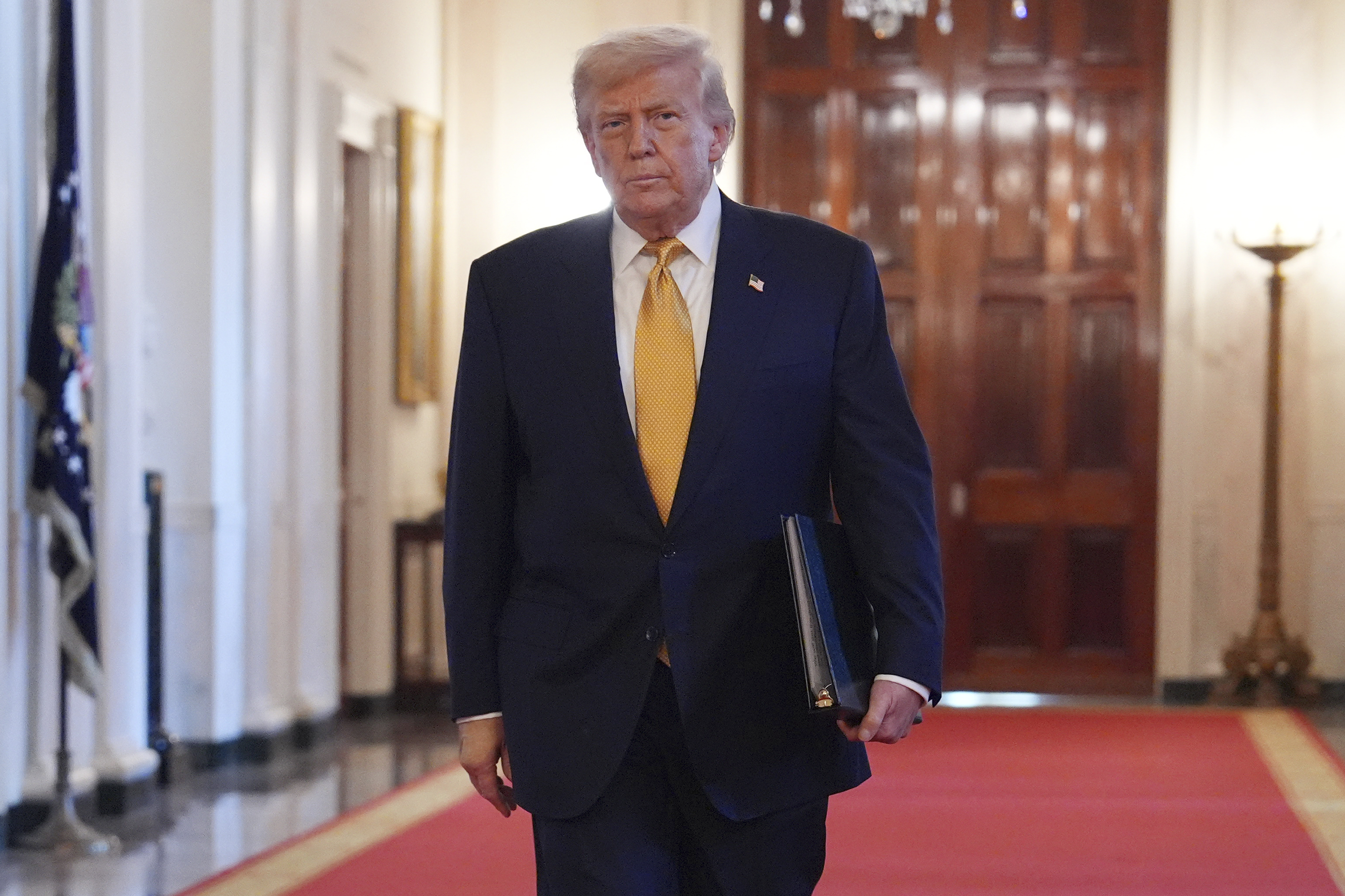 President Donald Trump arriving before speaking at a ceremony to sign the "Halt All Lethal Trafficking of Fentanyl Act," in the East Room of the White House, Wednesday, July 16, 2025, in Washington. (AP Photo/Evan Vucci)