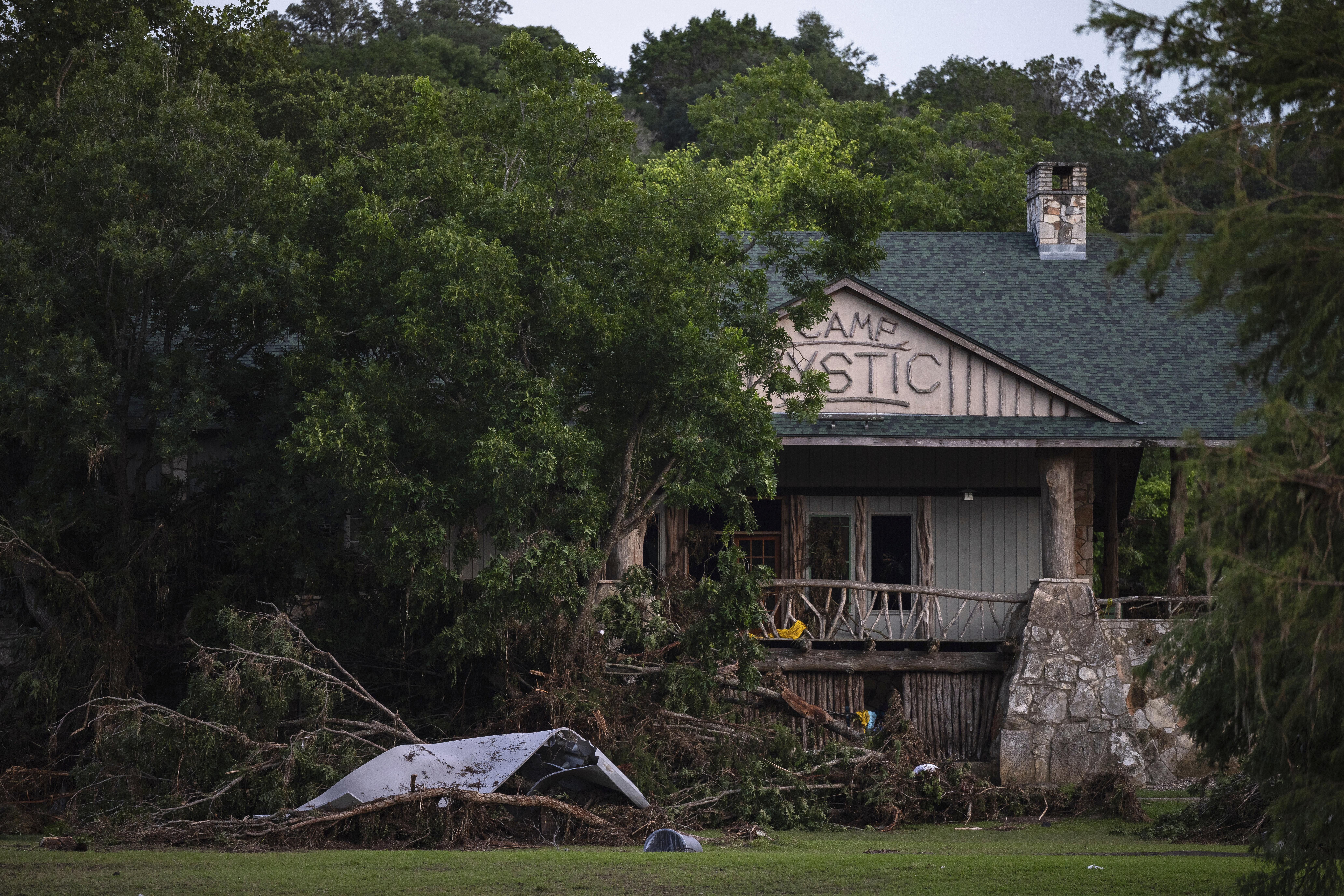 FILE - Debris covers the area of Camp Mystic in Hunt, Texas, Monday, July 7, 2025, after a flash flood swept through the area. (AP Photo/Eli Hartman, File)