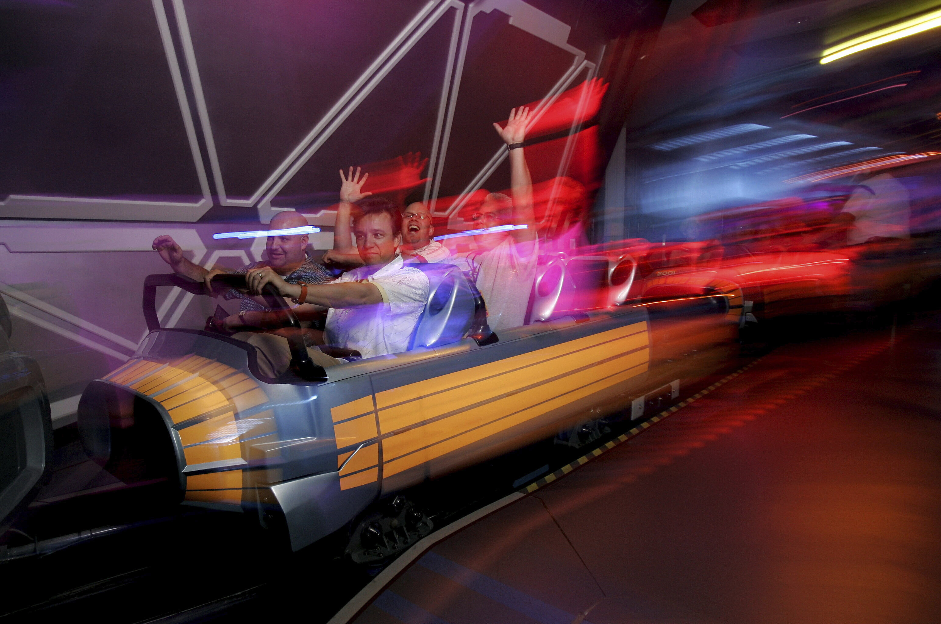 FILE - Guests ride Disneyland's "Space Mountain" attraction in Anaheim, Calif., July 15, 2005. (AP Photo/Kevork Djansezian, File)