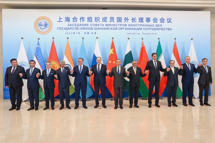 In this photo released by Russian Foreign Ministry Press Service on Tuesday, July 15, 2025, Russian Foreign Minister Sergey Lavrov, center left, and Chinese Foreign Minister Wang Yi, center right, pose for a photo with other officials during the meeting on the Council of Foreign Ministers of the Shanghai Cooperation Organization (SCO), in Tianjin, China. (Russian Foreign Ministry Press Service via AP)