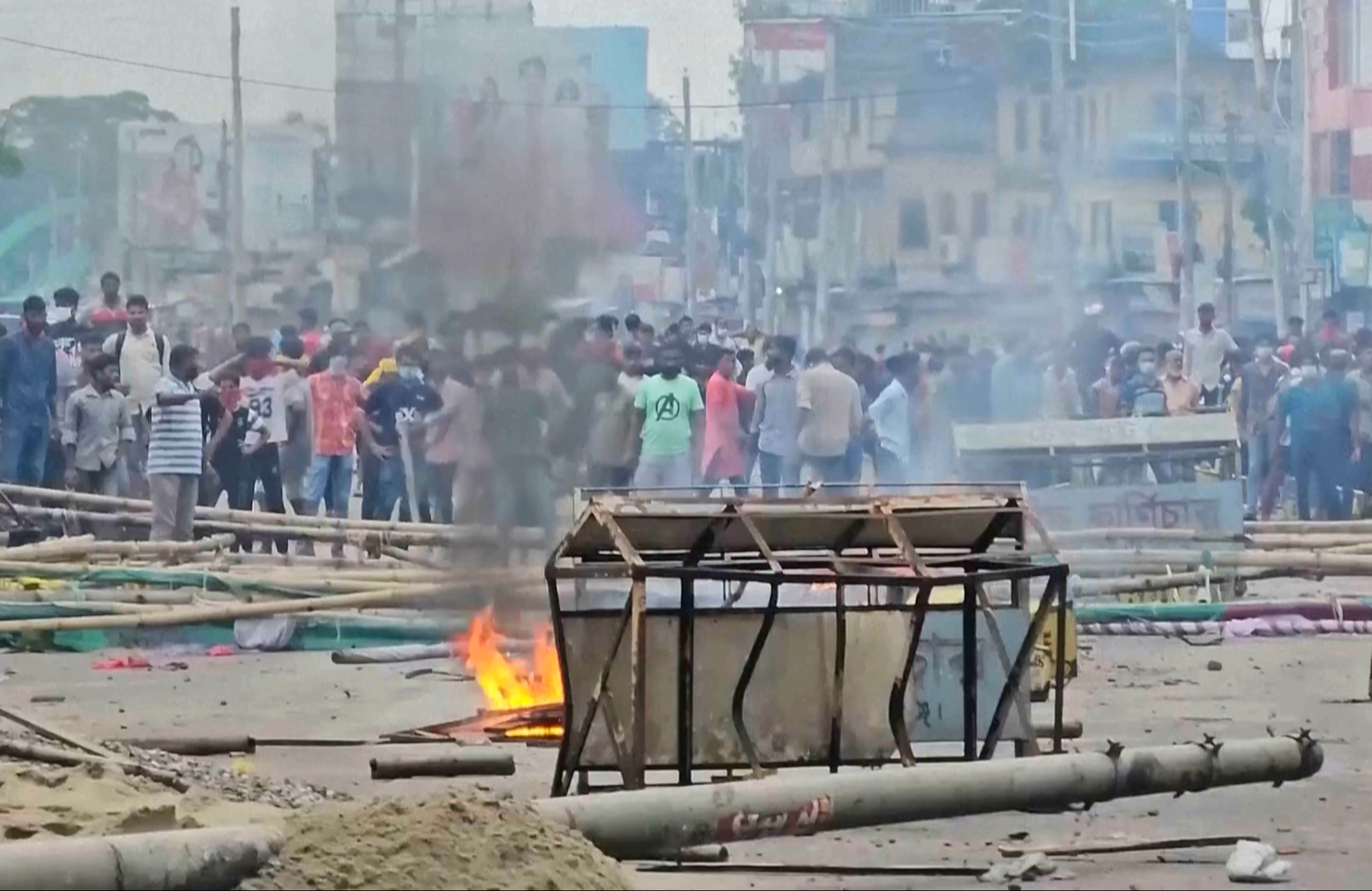 In this image made from a video, supporters of the ousted Prime Minister Sheikh Hasina clash with the police in Gopalganj, Bangladesh, Wednesday, July 16, 2025. (AP Photo)